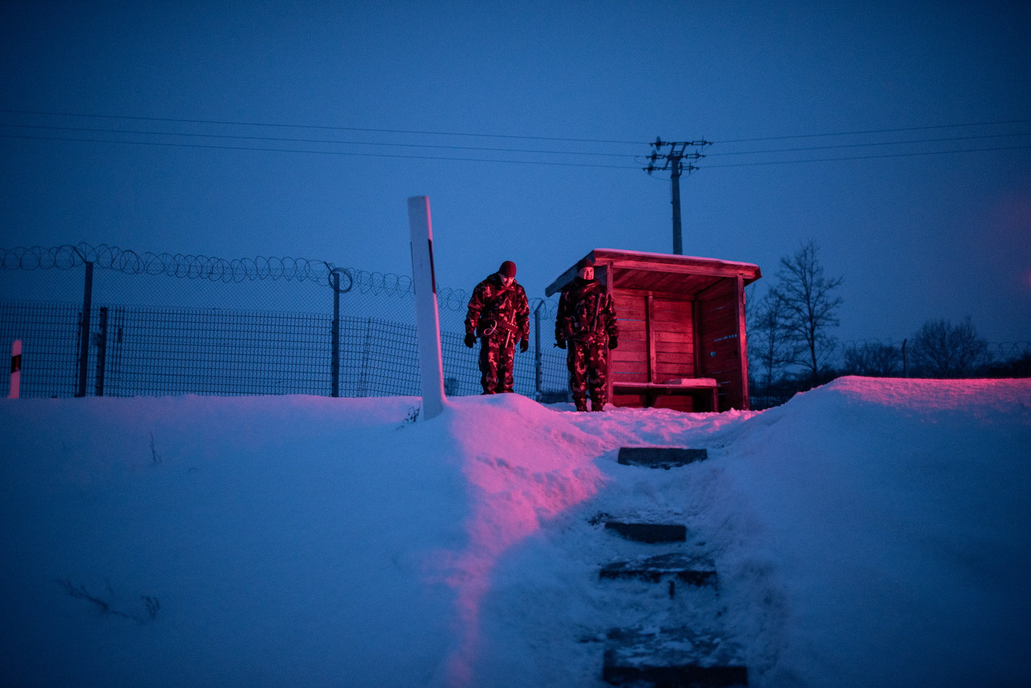  Soldiers stands in front of a military shelter to secure the border between Hungary and Serbia near Gara, Hungary 27 February 2018. The Hungarian border fence was constructed in the middle of the European migration crisis in 2015, with the aim to en