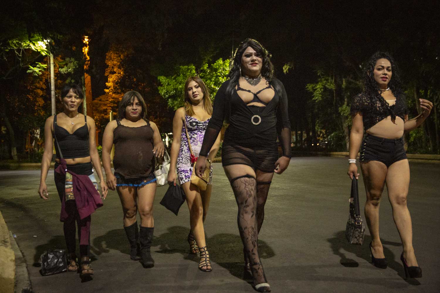  Ruby, JLO and other members of the LGBT orgnisation Arcoiris walk to their spot in Tegucigalpa they call El Obelisco, where they work during the night in prostitution. It is often  hard for LGBT people to find a job.   