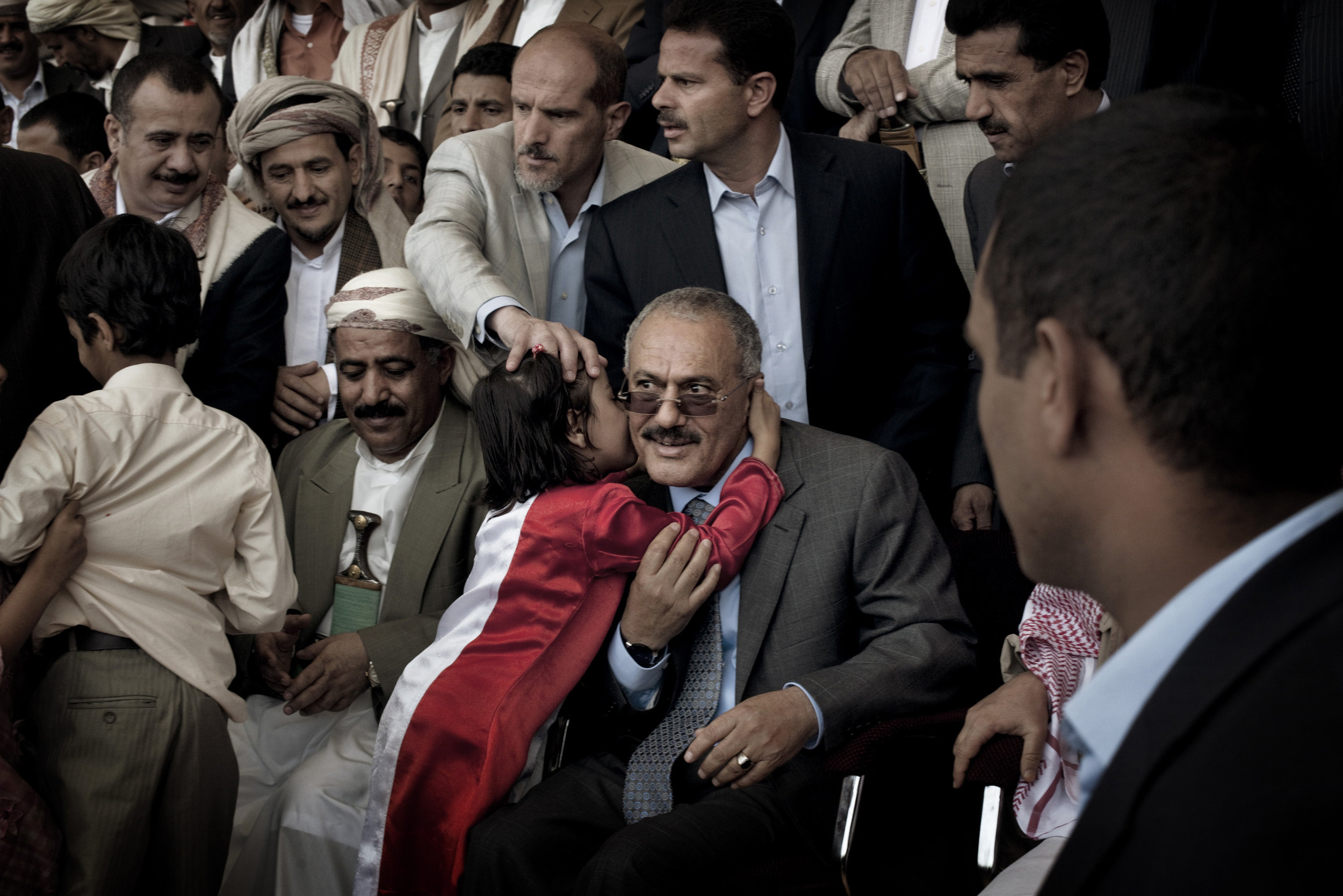  SANAA YEMEN-- MAY 2011:  A  young  supporter  kisses Yemeni President Ali Abdullah Saleh during a pro-government rally in Sana'a,

 in a defiant speech to thousands of flag-waving supporters in the Yemeni capital, Saleh declared: "We will confront a