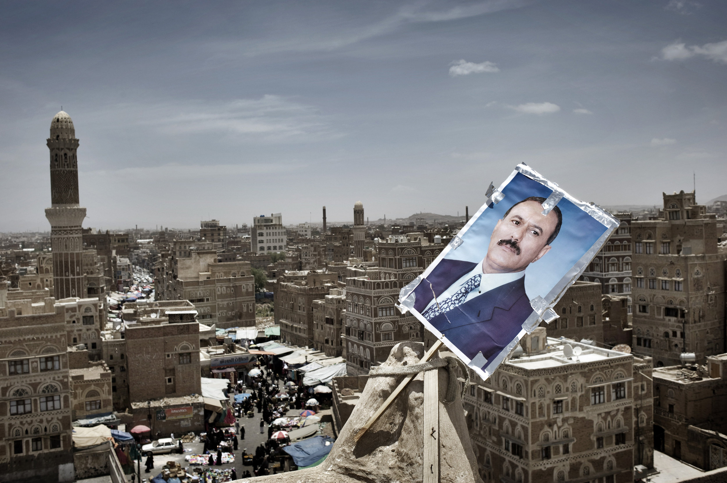  SANAA YEMEN-- MAY 2011: 
 A poster of Yemen's President Ali Abdullah Saleh   is seen  at  the  roof  of  the  house  at  the old  town  of Sanaa

 