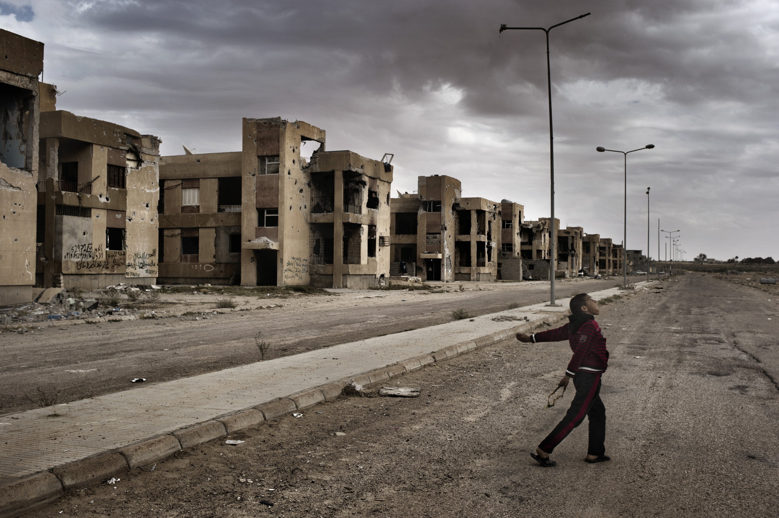  Sirte Libya  March  31 2012: Children play with slingshots in Sirte, the late Libyan dictator Muammar Gaddafi?s hometown. Sirte was one of the last loyalist strongholds in the nearly year-long war that ended the 42-year regime of Muammar Gaddafi, an