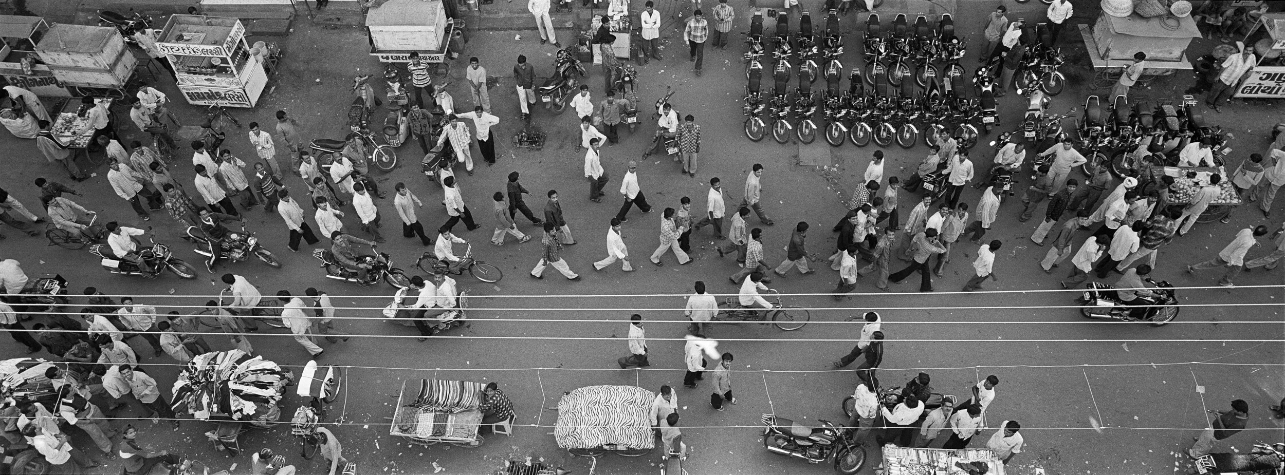 India, Surat, 2007, People walking on street.