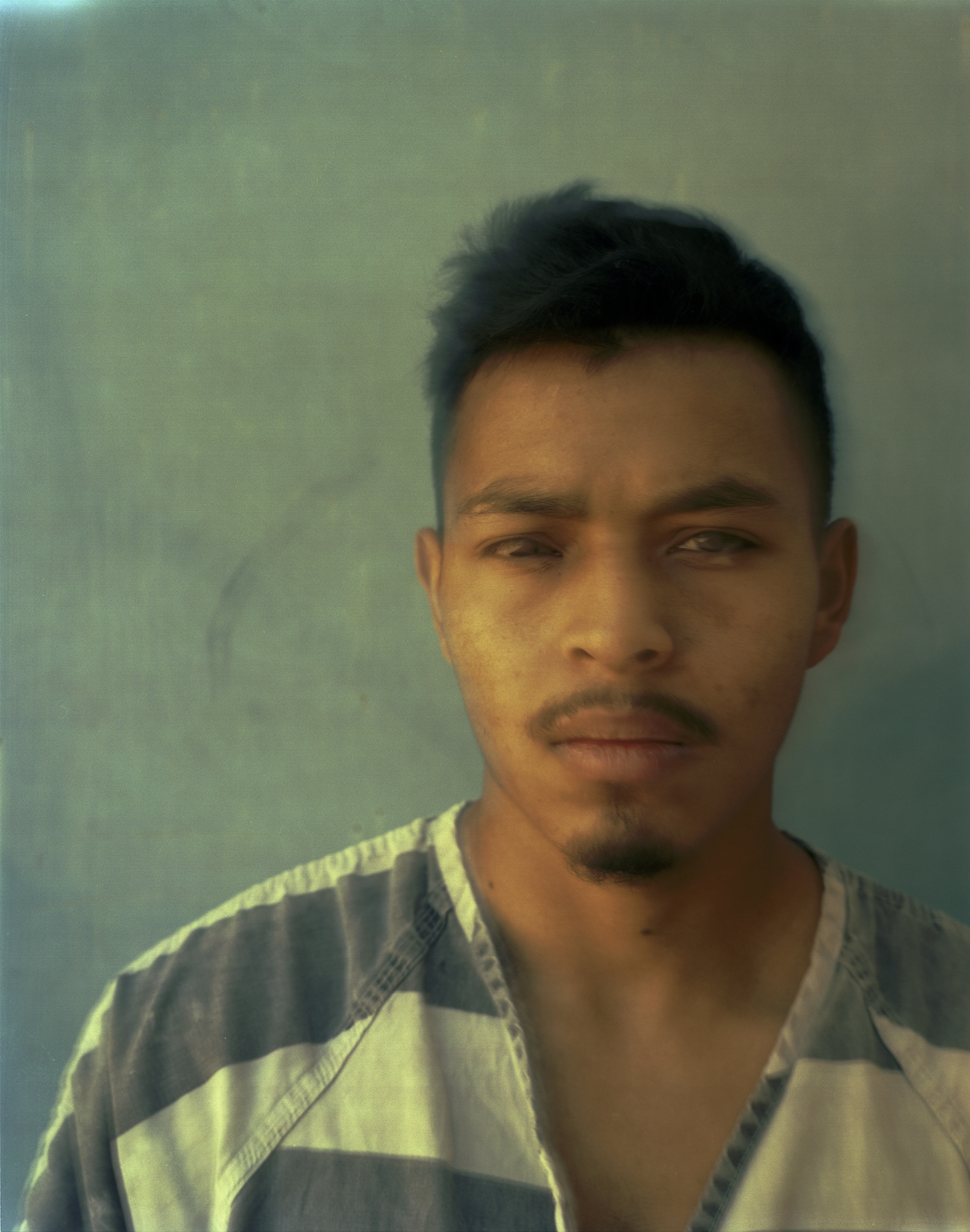  Josue Enrique Vargas, Michoacan, Mexico worked as a home painter in the United States. He had been in the United States for five years when he was picked up for a DUI (drunk driving) arrest. 

Portraits of undocumented Latin American immigrants inma