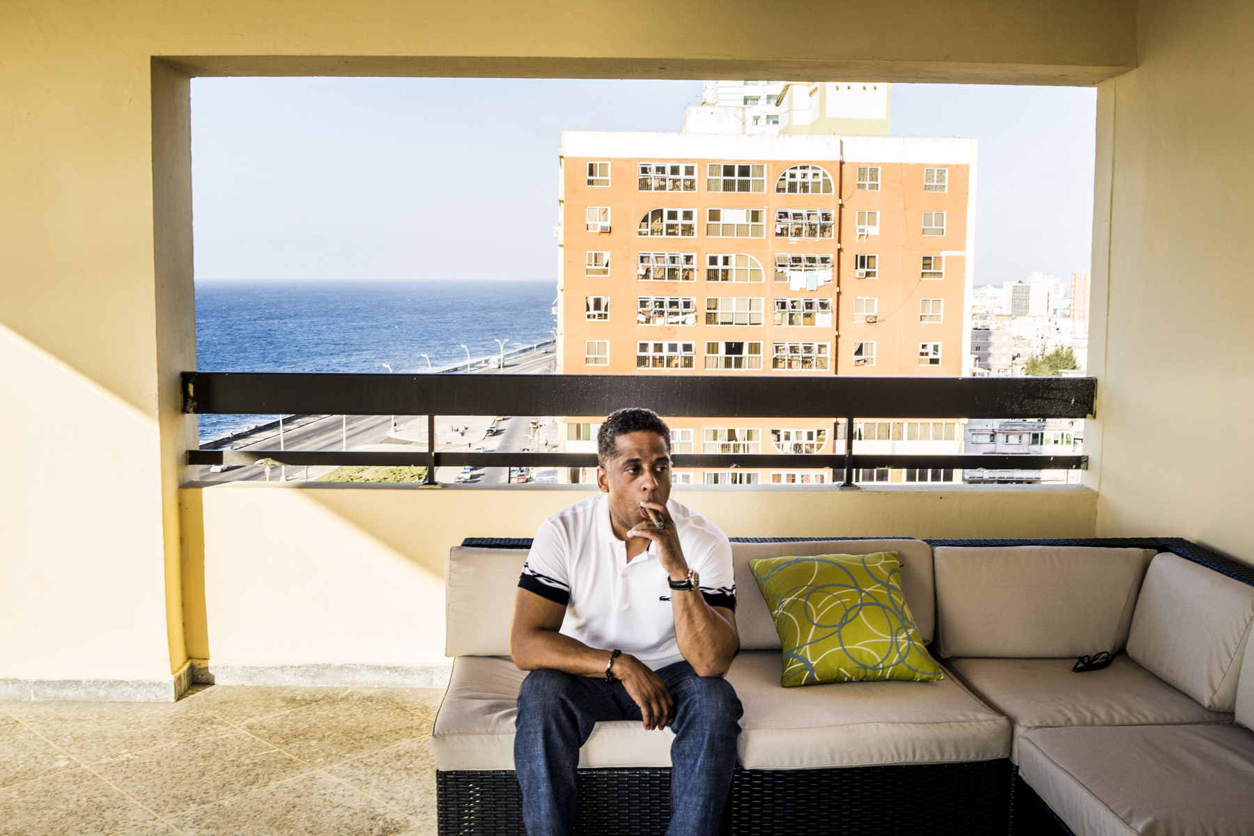  Havana, Cuba - February, 2015: Hugo Cancio, CEO of the OnCuba Magazine in his apartment balcony in Havana. 

For the first time in fifty years the United States and Cuba would restore ties and seems that the life conditions for Cubans will improve a