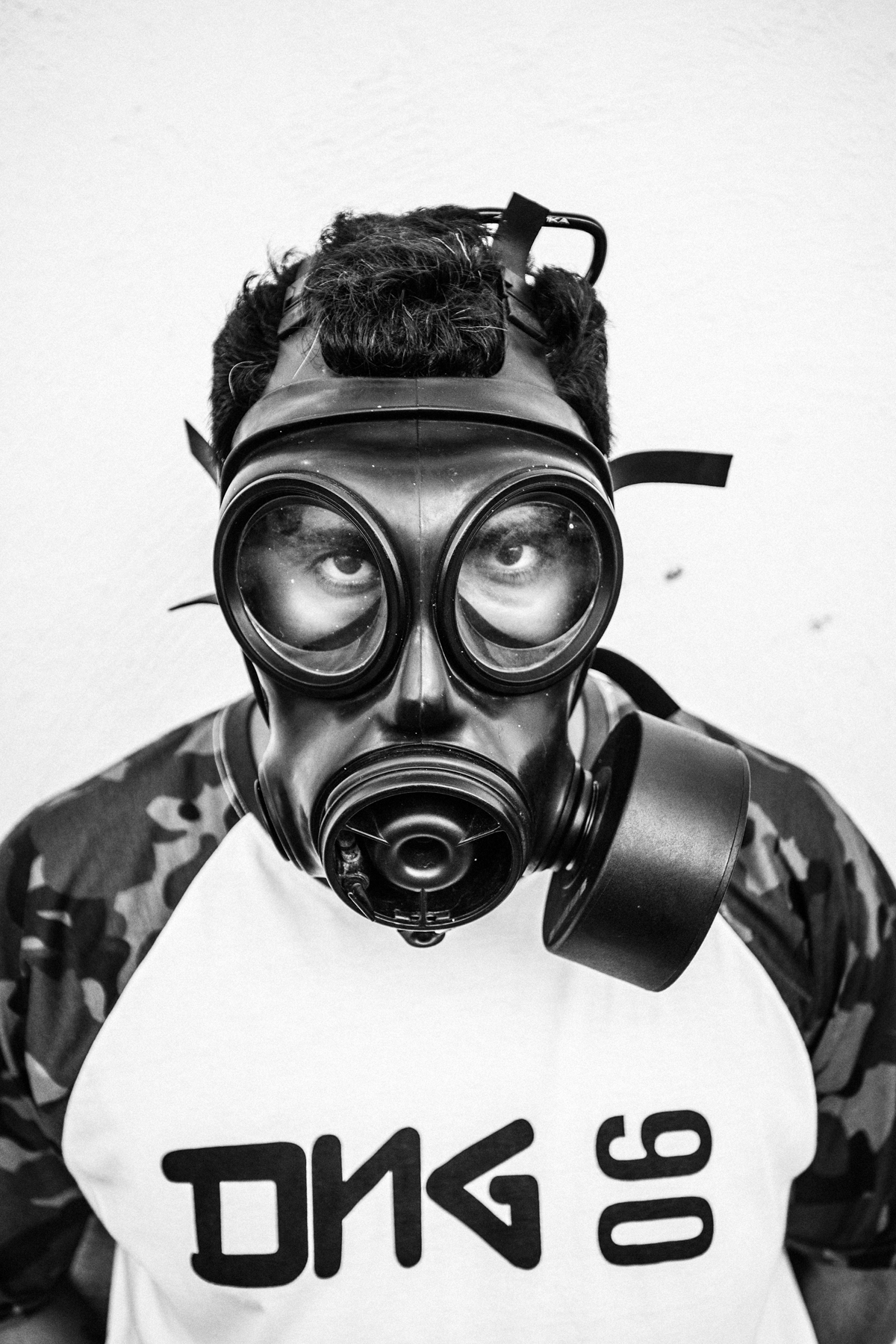  February 2015 - Rio de Janeiro, Brazil: Raul, one of the members of Papo Reto collective, posing with a gas mask 