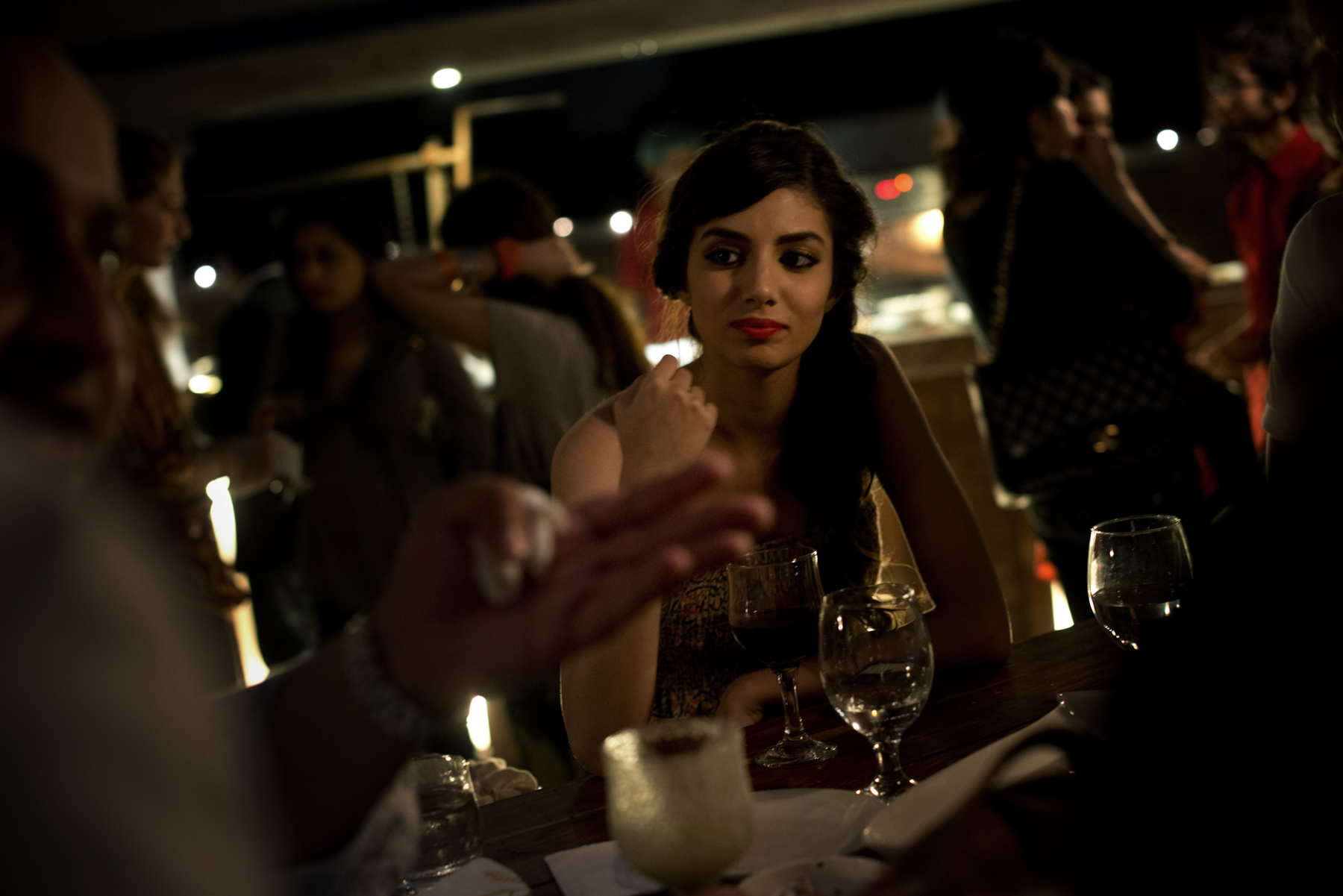  Models sip wine at a fashion show after party in Lahore. 