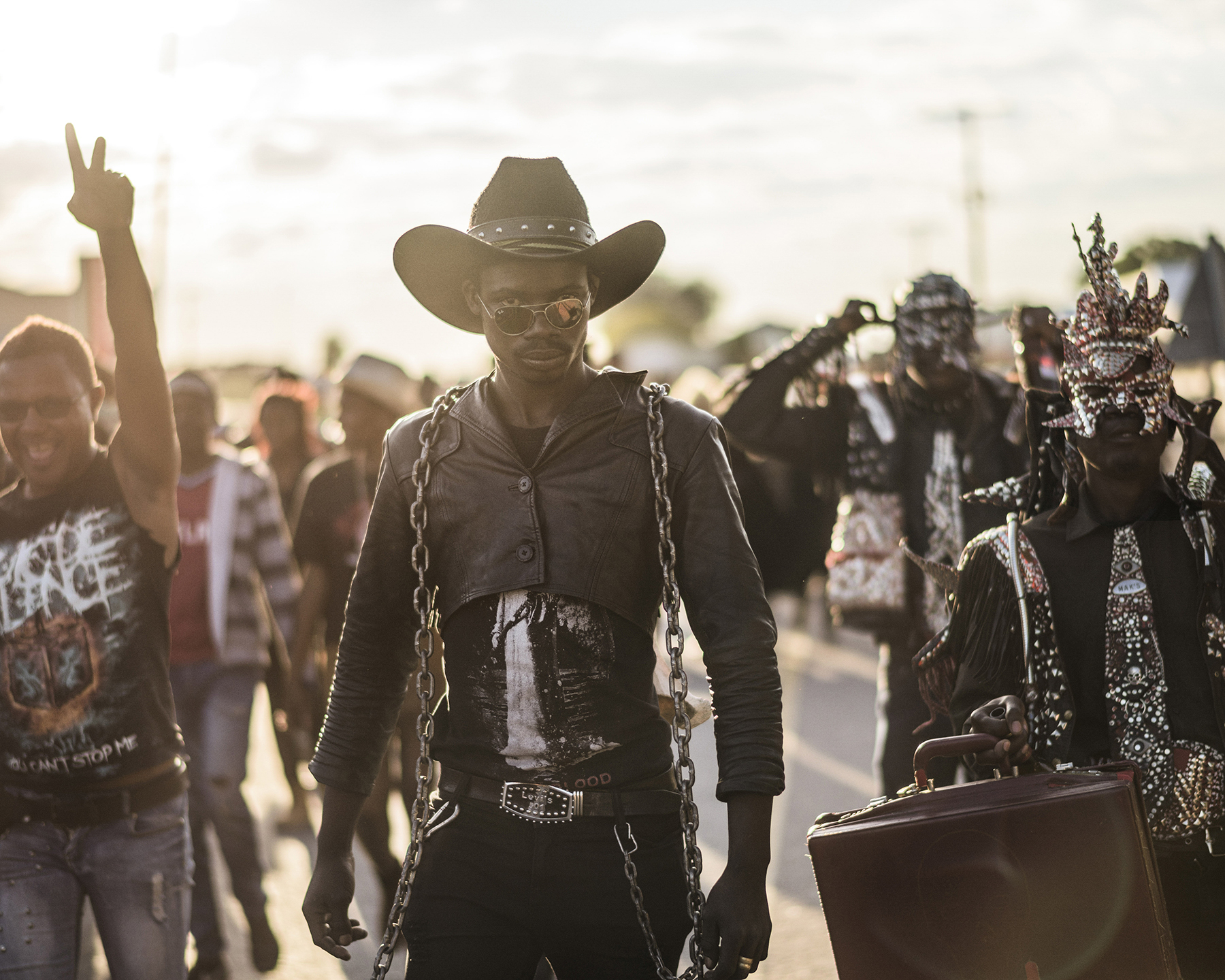  Botswana, Ghanzi, May 2017

8th Anniversary Overthrust "Winter Metal Mania Fest 2017" at Ghanzi community Hall.
People gathering in front of the small shopping mall in Ghanzi just before the ?March against Poverty? starts ? the metal community is pa