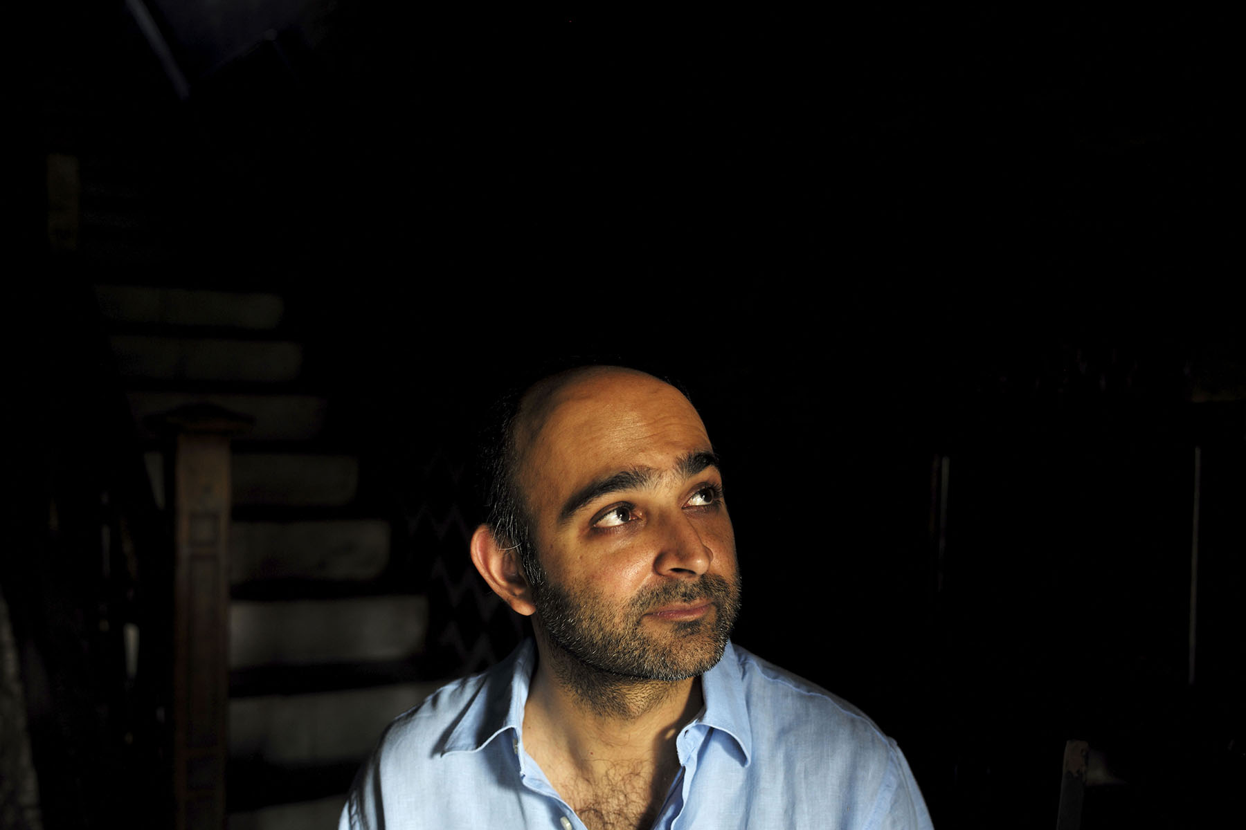  LAHORE, PAKISTAN; AUGUST 2103 
Award winning Pakistani writer Mohsin Hamid is pictured in the deark interior of an old house in Anarkali, Lahore?s red light district. The author of Moth Smoke, The Reluctant Fundamentalist and How to Get Filthy Rich 