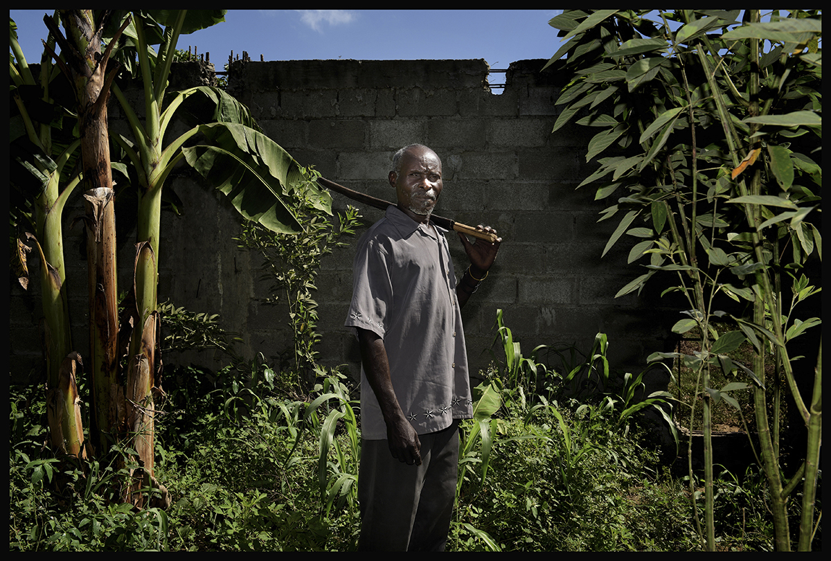  Haiti, near Caracol, July 2016

Willy Davilmar, poses in front of the wall build around the industrial park. He lost land.

In January 2011, 442 families lost the land they had cultivated for decades in Caracol, Northern Haiti, to make way for one o