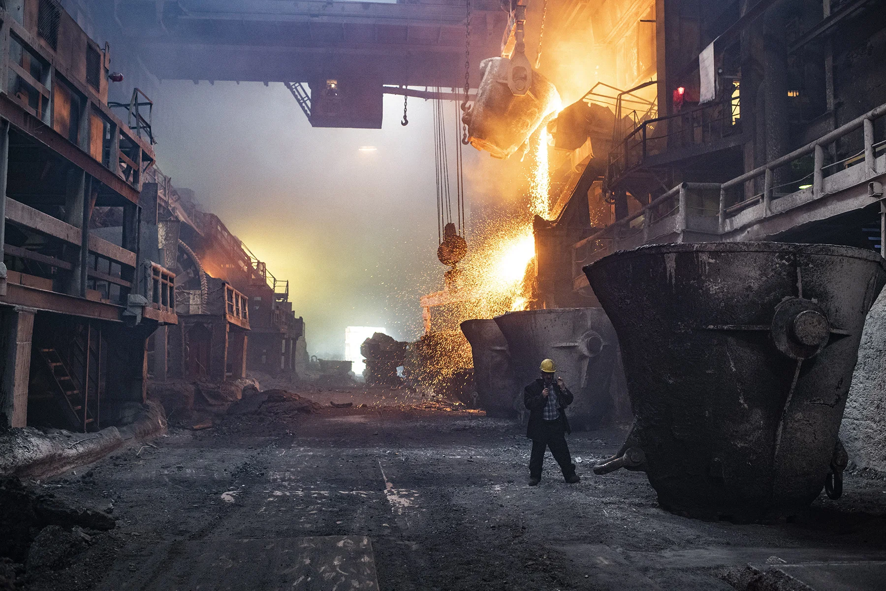 Russia, Taymyr Peninsula, Norilsk, July 2018
The copper factory.
Three plants of Norilsk — the nickel factory, the copper factory and the metallurgical complex “Nadejda” (“Hope”), were built successively in 1942, 1949 and 1981. 56% of the population works in these places.
As part of plans to clean up Norilsk’s reputation, in June of 2016 the company Norilsk Nickel shut down its nickel factory: a 74-year-old enterprise that emitted 350,000 tonnes of sulphur dioxide each year. But other plants in Norilsk have taken on the nickel factory’s operations, while the final stages of production are being transferred to plants in the Murmansk region, which Norway has long accused of sending “death clouds” of pollution across its border with Russia.
Yuri Kozyrev / NOOR for Carmignac Foundation