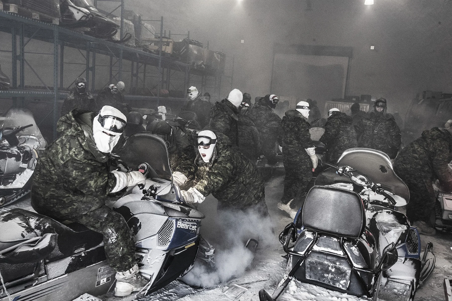 Canada, Qausuittuq (Resolute Bay), March 2018
An attempt to start up the snow scooters at extreme temperatures is an effort; fuel pumps often freeze.
Operation NUNALIVUT 2018 is conducted every year in the high Arctic of Canada. It focuses on patrolling the High Arctic, learning about winter survival, training with the Canadian Ranger Patrol Group, which is an Inuit unit.
An attempt to start up the snow scooters at extreme temperatures is an effort; fuel pumps often freeze.
The Canadian army is increasing their presence in the high Canadian Arctic. Under harsh condition; temperatures around -45 celsius they are being trained to survive and operate. The Arctic Ranger, an Inuit unit from the Canadian army, used to the circumstances trains them.
Kadir van Lohuizen / NOOR for Carmignac Fondation