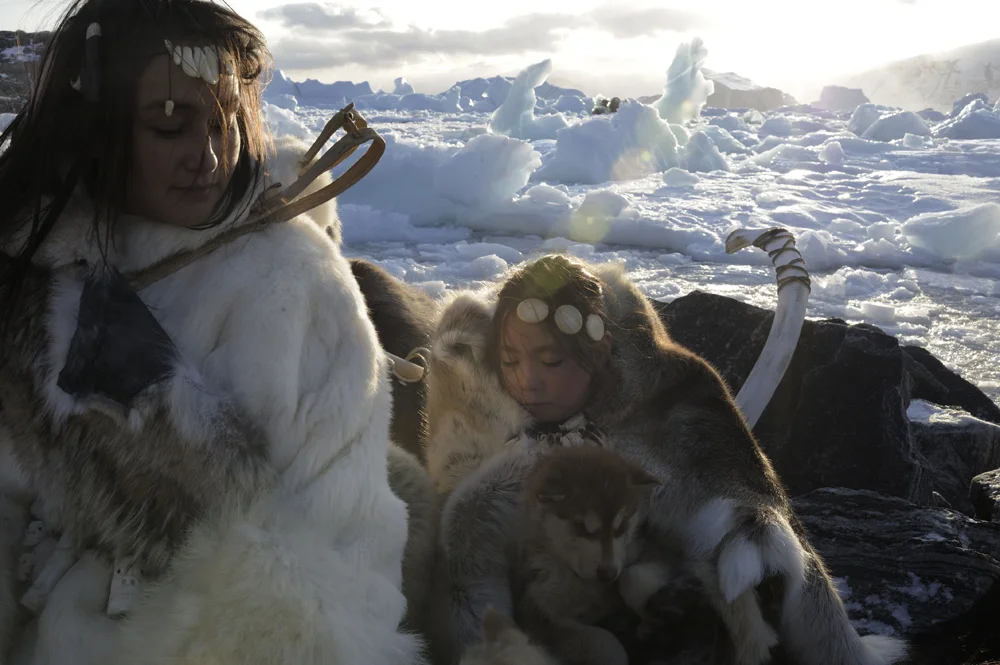 We have called them Eskimos, but they are Inuit, and they have always named themselves as such. The name eskimos comes from the word "Eskimautik", which means "Those who eat raw meat", the people of the North. Traditional dress of Polar bear, seal skin, boots and fur-lined coverings have help Inuit people to survive some of Earths coldest weather for centuries.
With out sea ice, seals cannot build ledges, on which to rest, eat and bear their pups, walruses cannot find refuge on drift ice to rest, and digest their meals, of clams and other shell fish, polar bear cannot catch seals, if there is no ice hunters cannot travel in dog sled in search of game, for food and skins. Arctic biologists say that the entire eco system is in collapse. Because of the disappearing cold ice, hunters have to shoot their dogs, because there is not enough food to feed them, without sea ice without, sled dogs, with out Polar bears, marine mammals and birds, traditional life in the arctic could crumble pretty quickly, and with out the skins of polar bears and seals the Inuit culture will die out.