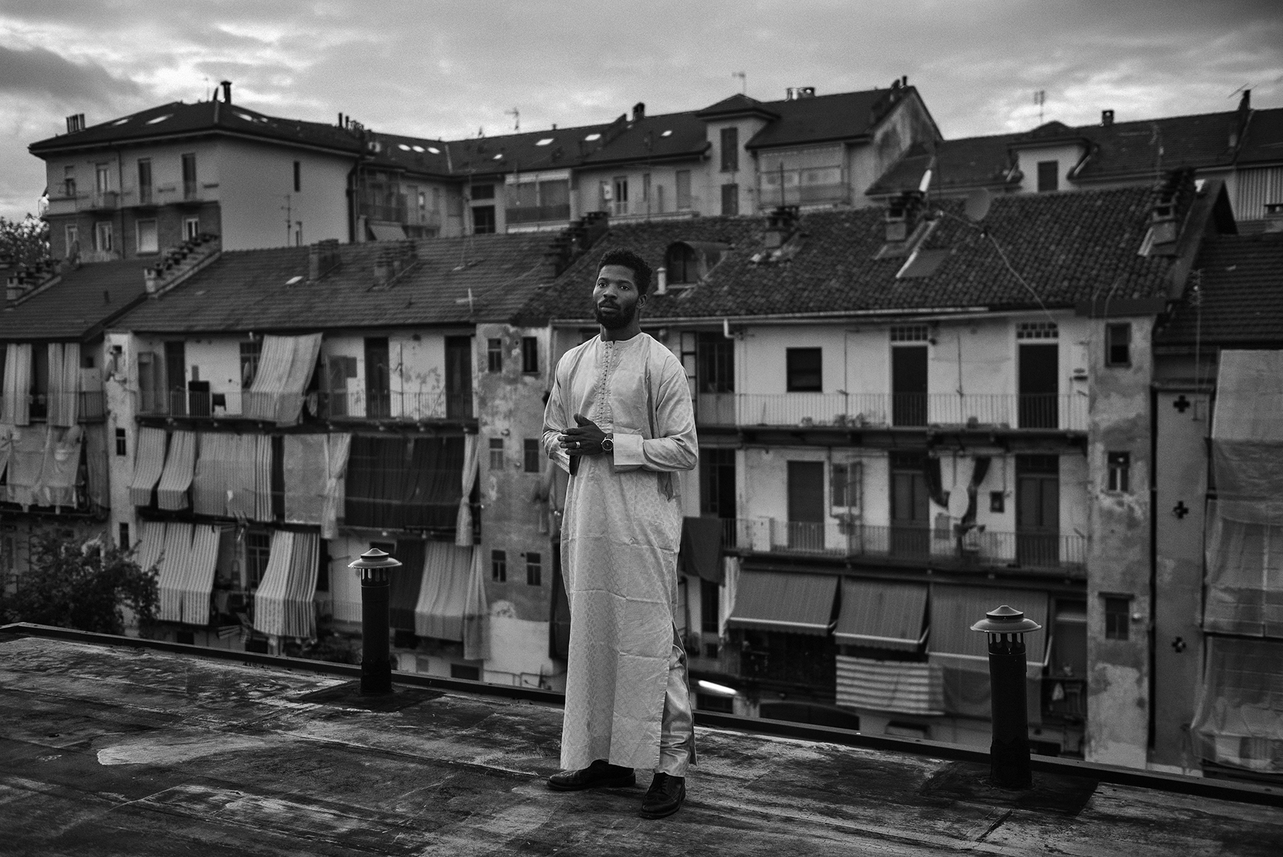  Jacob Bamba (30) portrayed in the rooftop of the Public Baths of Via Agliè in the working-class district of Barriera di Milano in Turin, Italy; November 2018.
Mr. Bamba - who arrived in Turin when he was 18 - has lived for 2 years in a small apartme