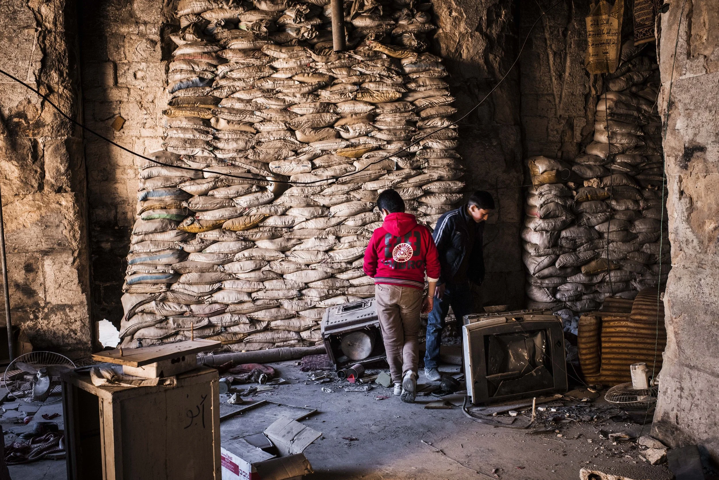 Syria, Aleppo, 24 March 2017
People at the destroyed Great Mosque of Aleppo.
The Great Mosque of Aleppo is the largest and one of the oldest mosques in the city of Aleppo, Syria. It is located in al-Jalloum district of the Ancient City of Aleppo, a World Heritage Site, near the entrance to al-Madina Souq.
Sebastian Liste / NOOR