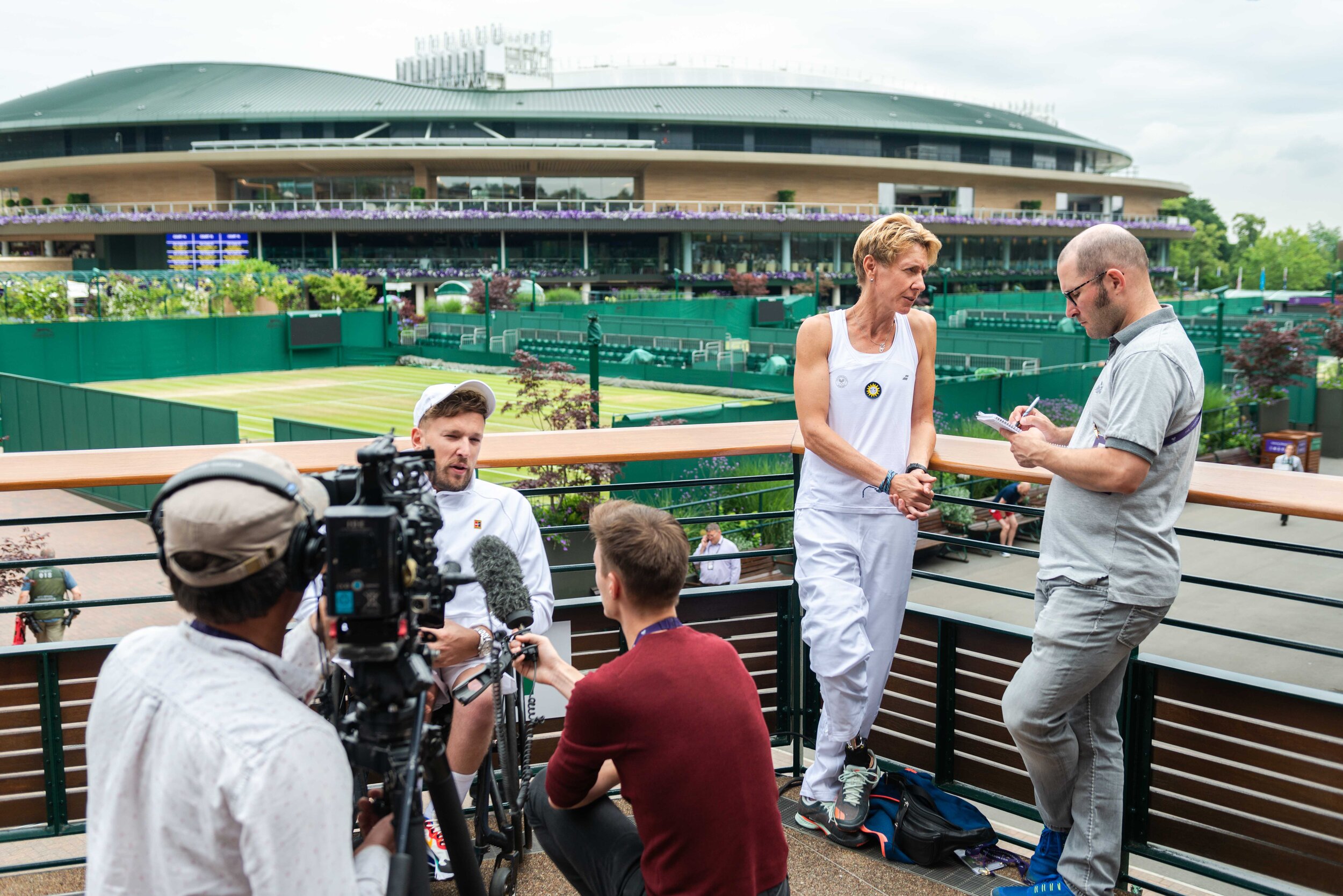  Sabine is giving an interview with a journalist during the media appointment at WImbleodn. 