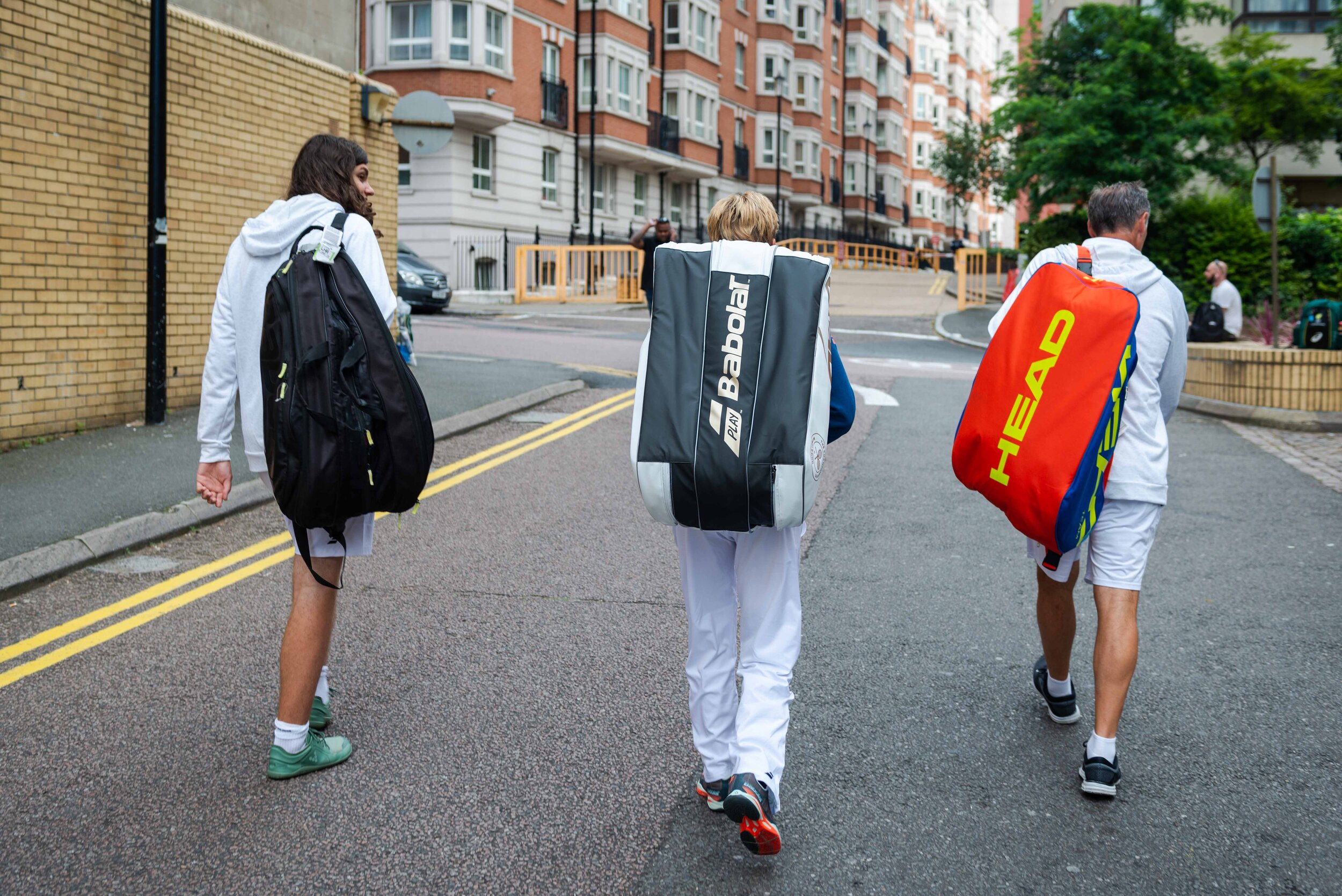  Sabine Ellerbrock, Tjard and Stefan Wöhle walk through Kensington, London. 