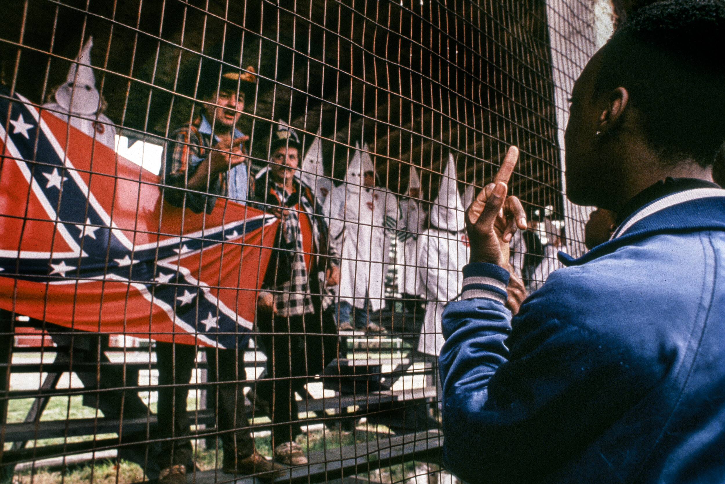  F*ck the KKK,  USA,  1990When the Ku Klux Klan , a white supremacist terrorist organization,  decided to march around a baseball field in a small town in southern New Jersey,  a crowd of protestors showed up to resist.  As the KKK donned their white