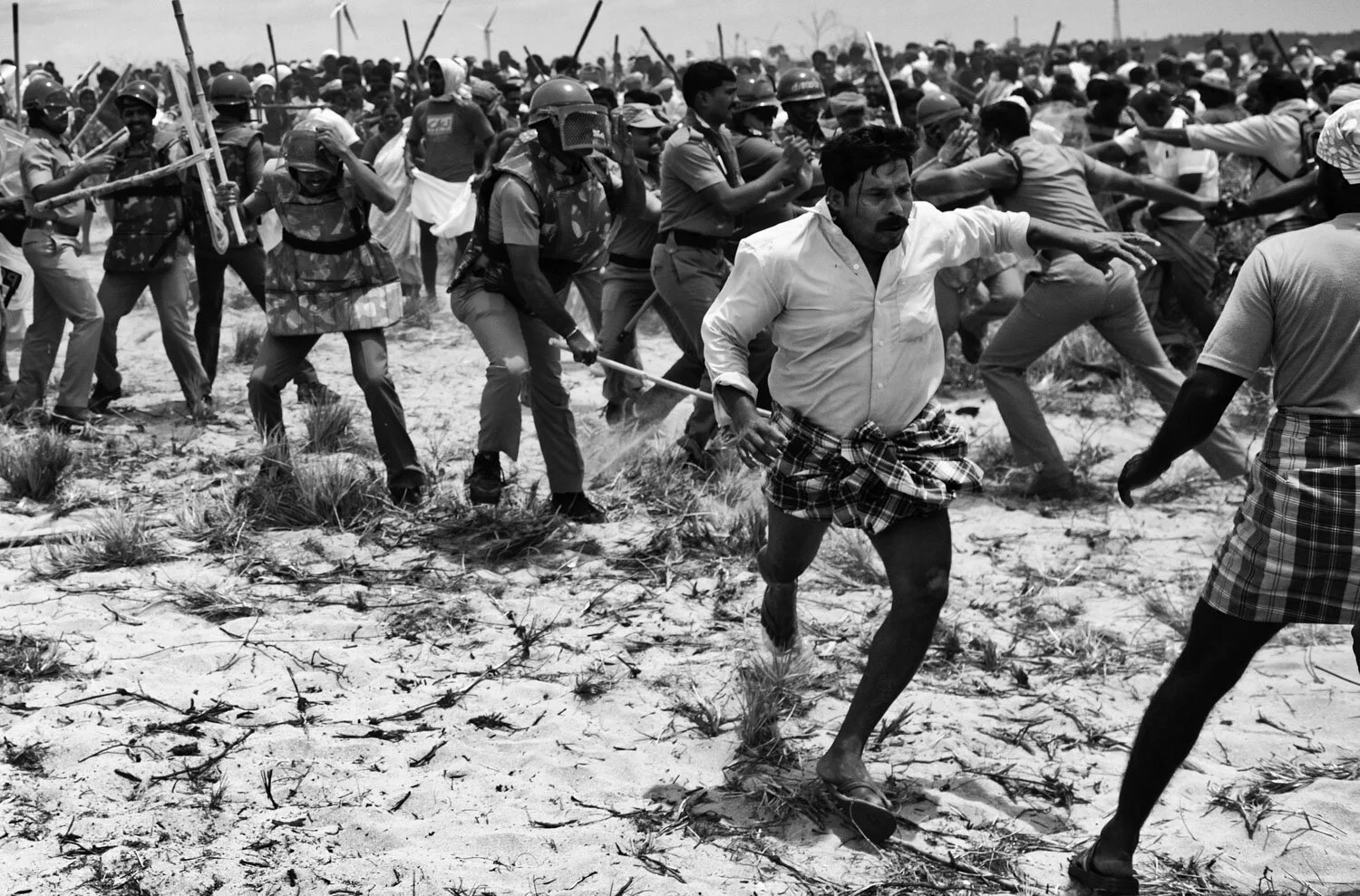  Napolean, a resident of Idinthakarai, runs after being attacked by the police. 
