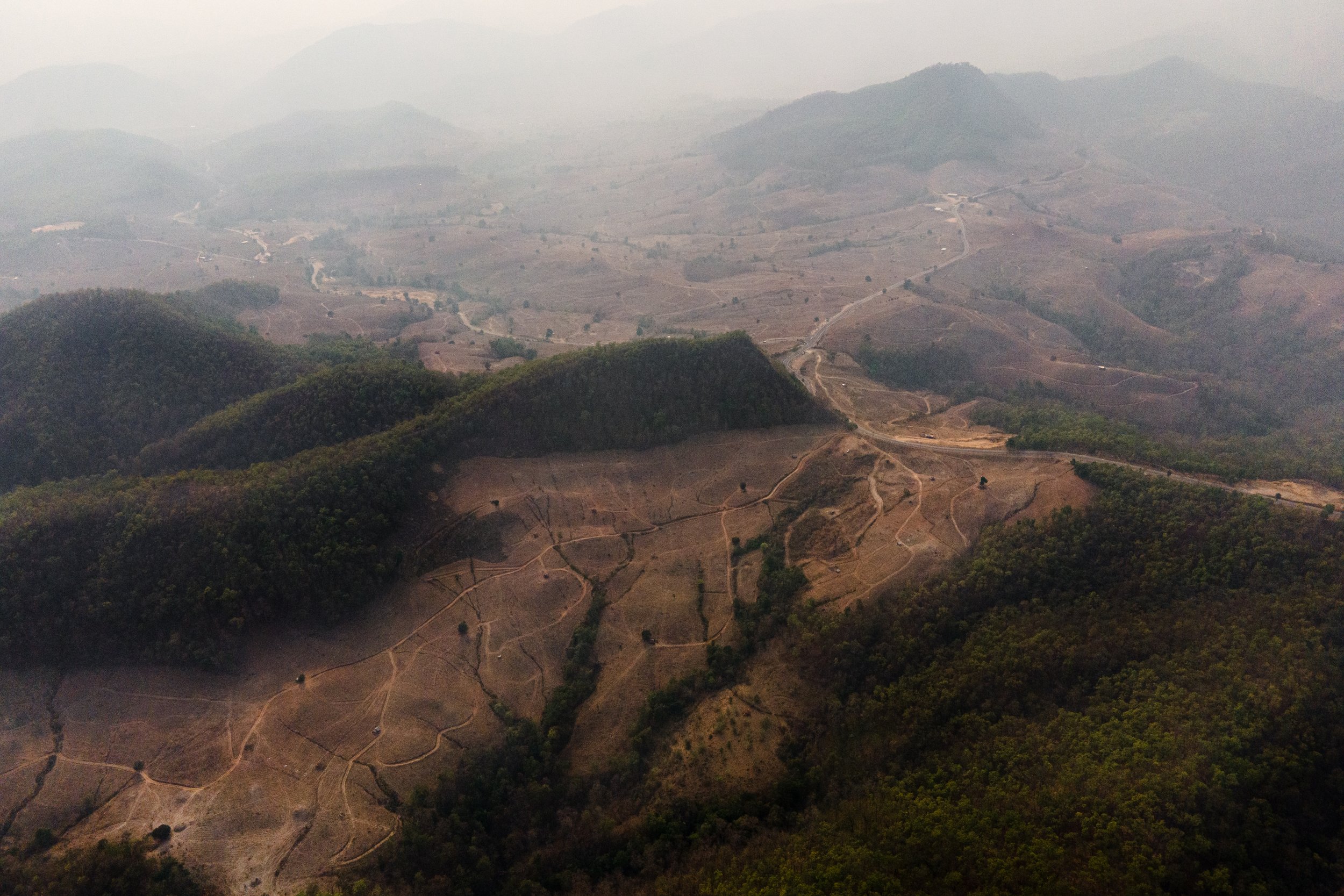  Thailand, Chiang Mai. 12 April 2023. The vast mountain range where corn is grown for animal feed is blanketed in heavy smog after the crop waste was burned to prepare the new plantations. Over the past 20 years, the demand for meat has increased in 