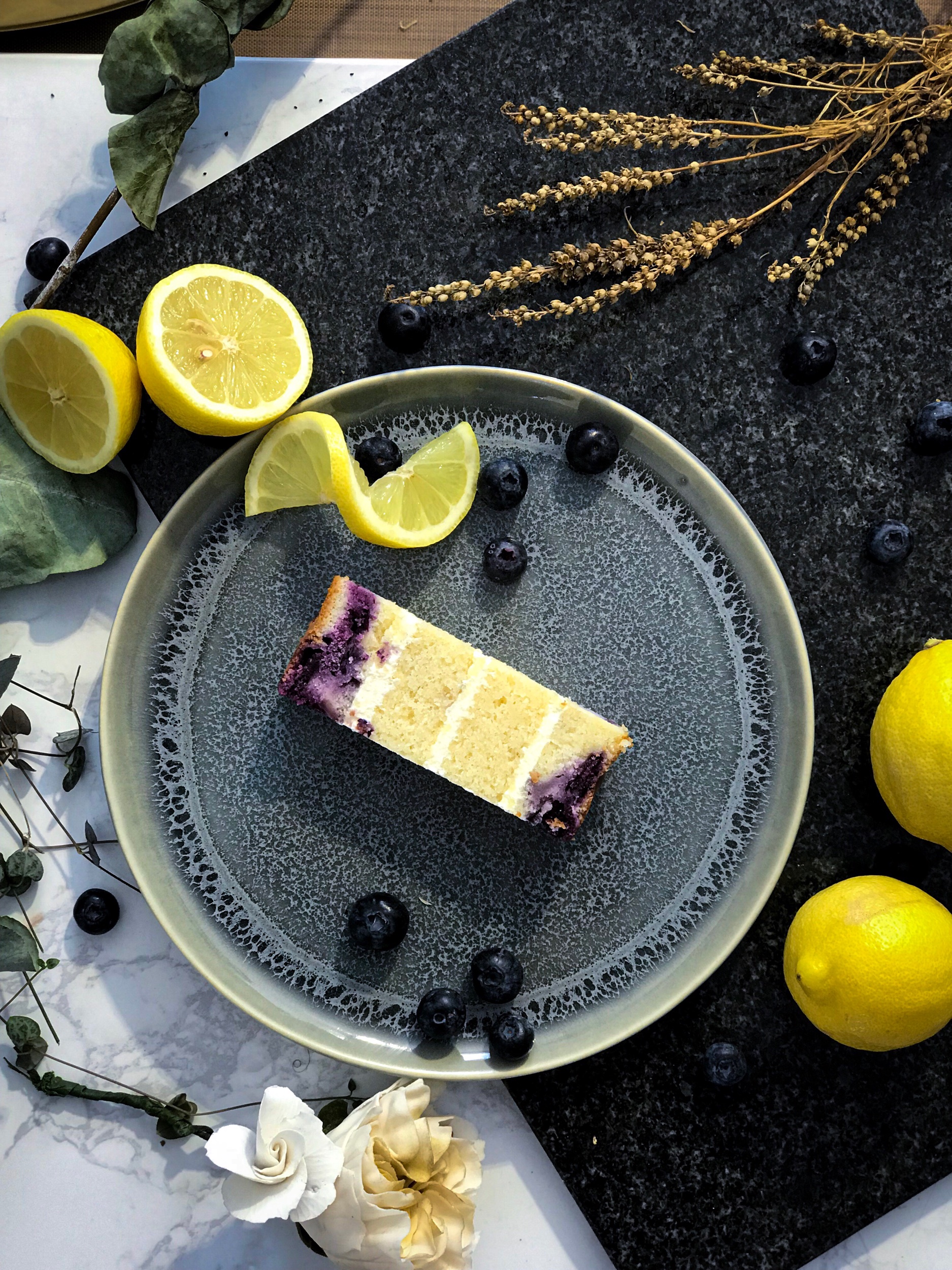 BLUEBERRY CHEESECAKE love a light textured cake? This one's for you. Lemon & wild blueberry cake with a cream cheese filling in between the fluffy layers cake.