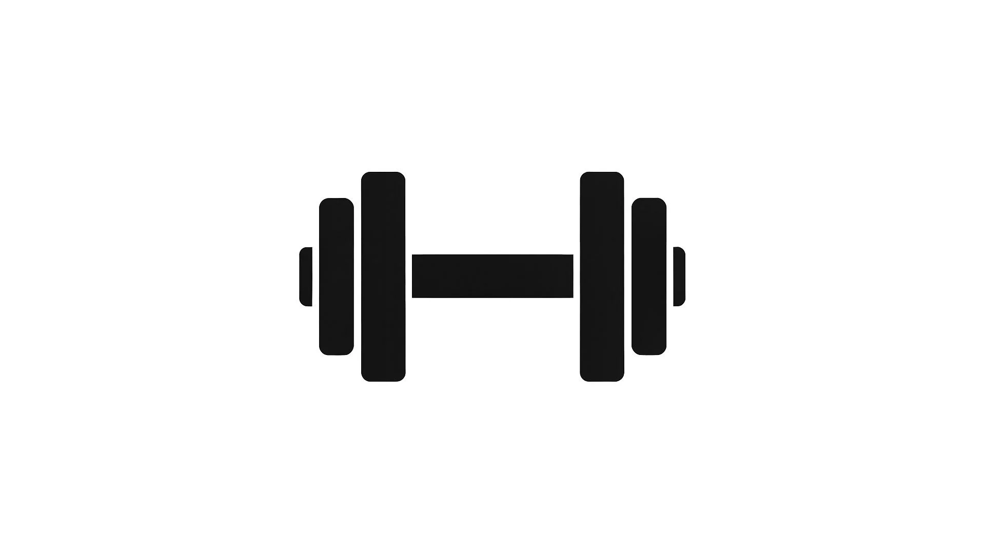 Two black 10 kg dumbbells on a black surface with a keyboard in the background.