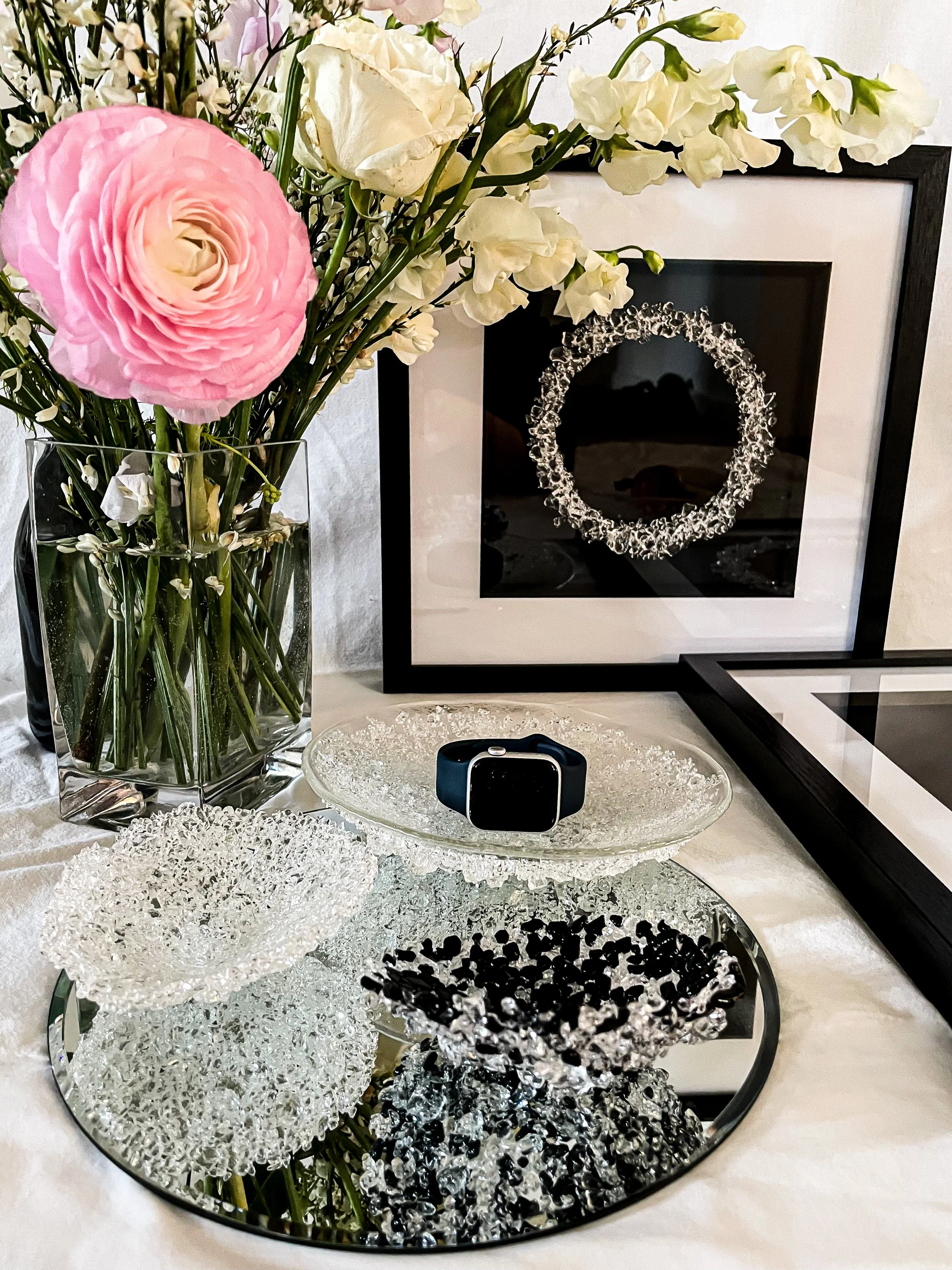 lifestyle image including framed art work, vessels, flowers, luxury lifestyle, iWatch by Naomi Jacques