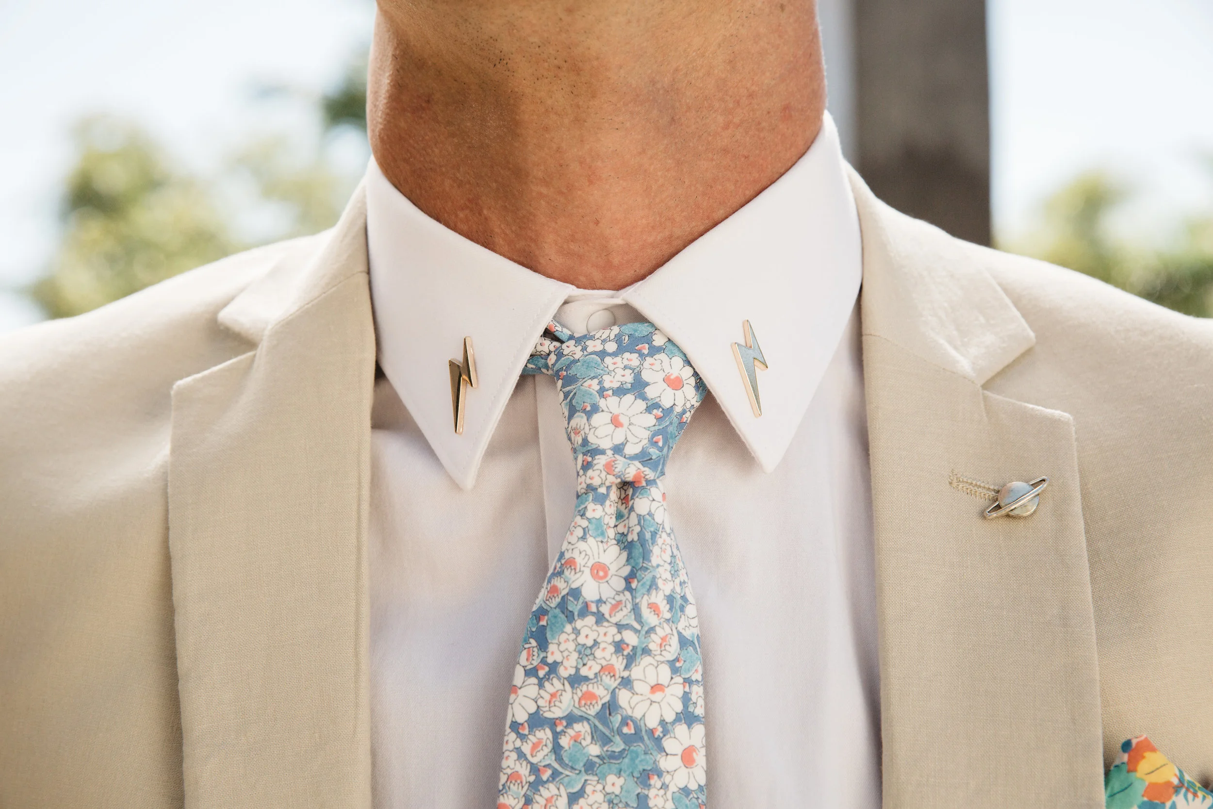 Jesse is one of our all time favorites with his lightning bolt collar pins, his colorful accents on his tie and pocket square, to his funky shoes and retro shades. His style pops!