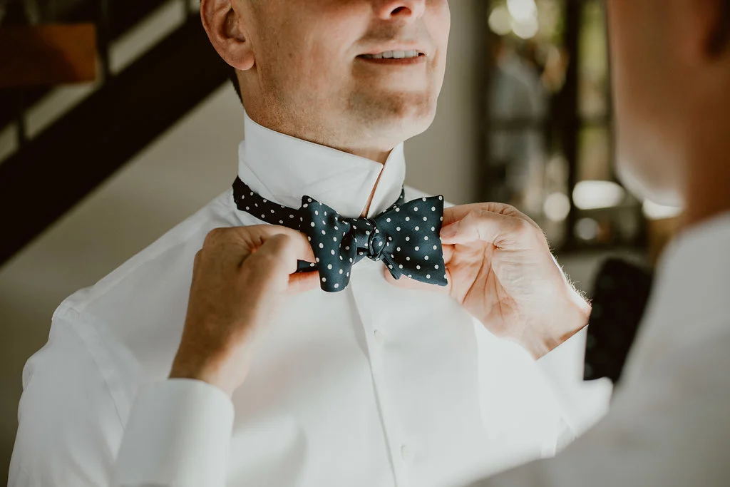 These lovely gentlemen are our other favorites. They are so classy and sharp! From their button downs to their bow ties. These guys have style like no other. Their suits have beautiful detailing that make a simple suit elegant. Even their bow ties are detailed! These two know fashion. 