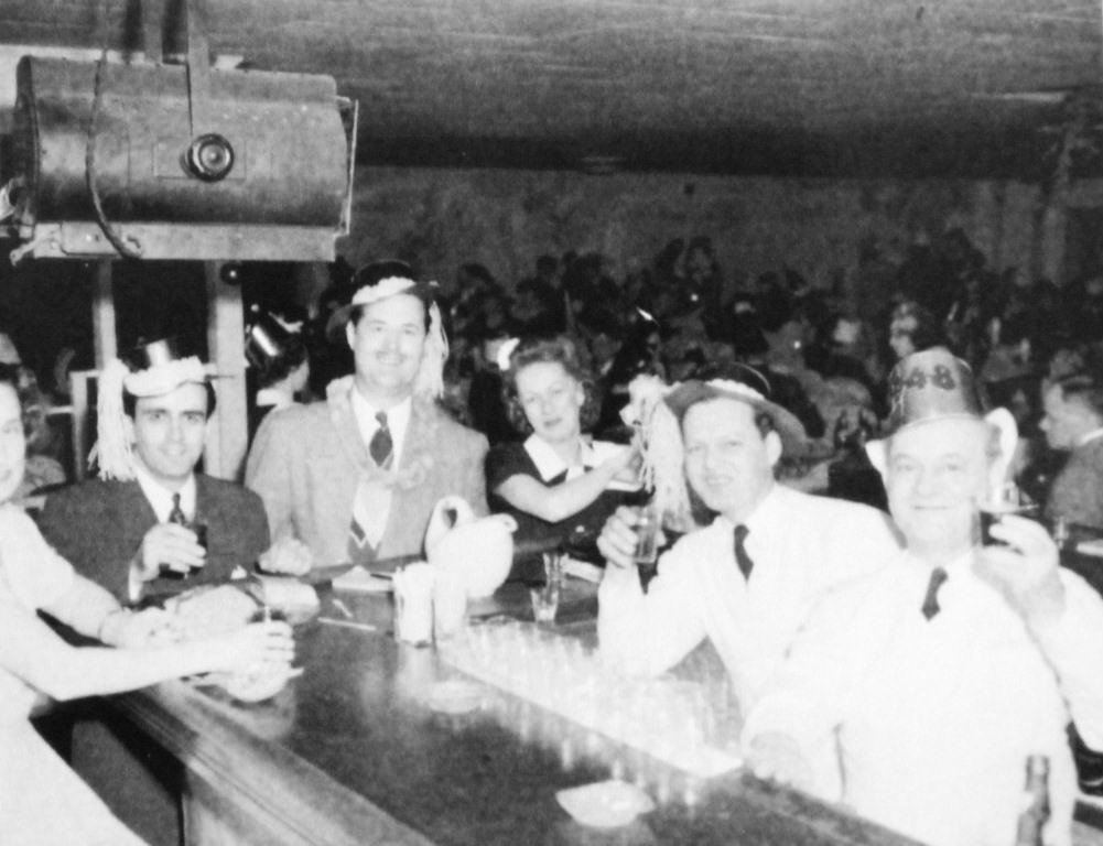 New Year's Eve at the Lake Club during its heyday. Owner Huge Giovagnoli is in the dark suit at the end of the bar. The bartender who took the photograph that night may have been Albert "Rudy" Cranor.