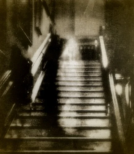 One of the most convincing photographs was the famous image of the "Brown Lady" of Raynham Hall in Norfolk, England. The photo was taken Captain Provand, a professional photographer, who was taking snapshots of the house for Britains Country Life magazine in September 1936. His assistant, Indre Shira, actually saw the apparition coming down the staircase and directed Provand to take the photo... even though the other man saw nothing at the time. The resulting image (shown here) has been examined by experts many times, although no explanation for it has ever been given.
