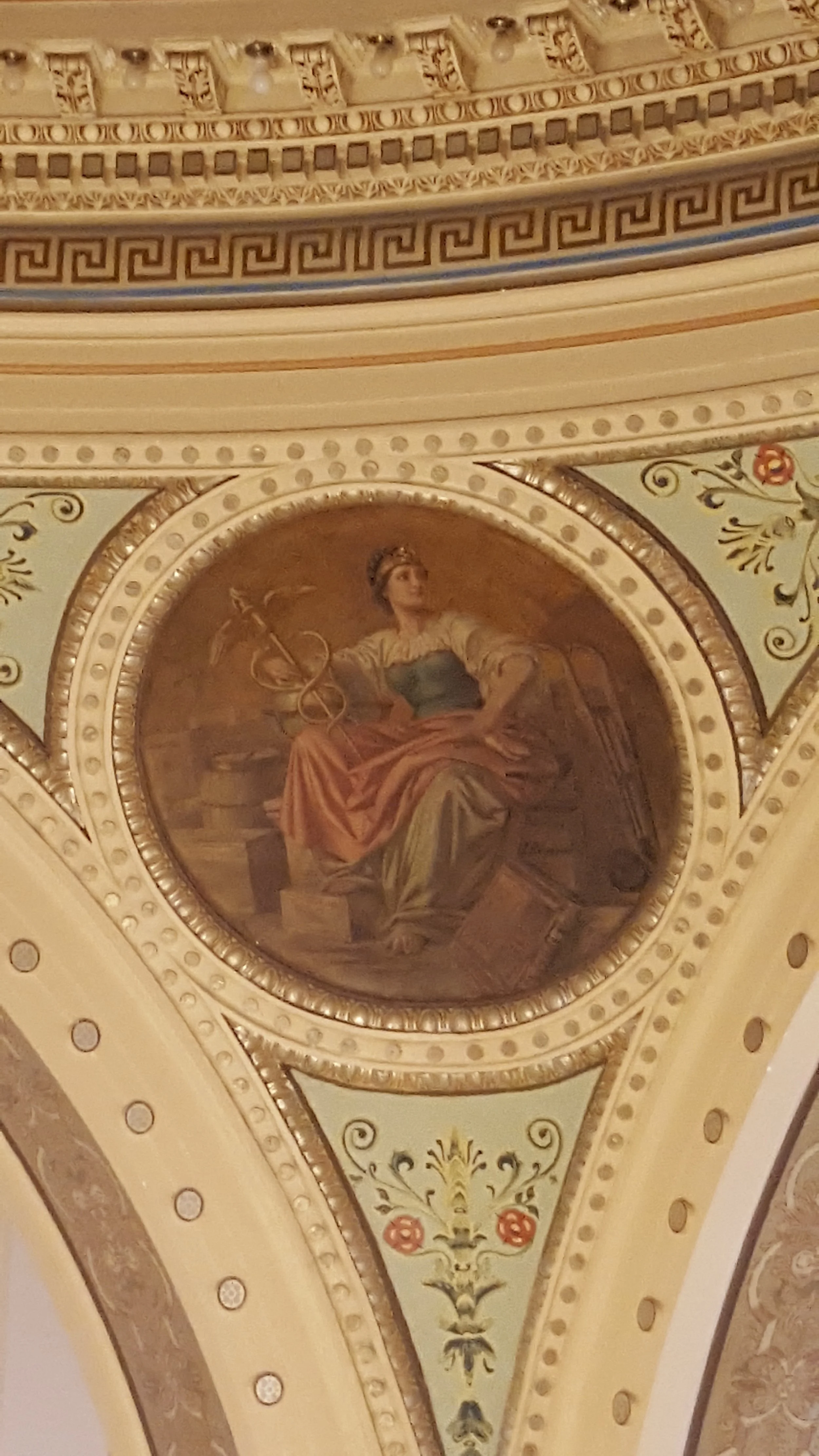 The Medicine medallion by Franz Rohrbeck is located in the domed Rotunda at the Manitowoc County Court House.