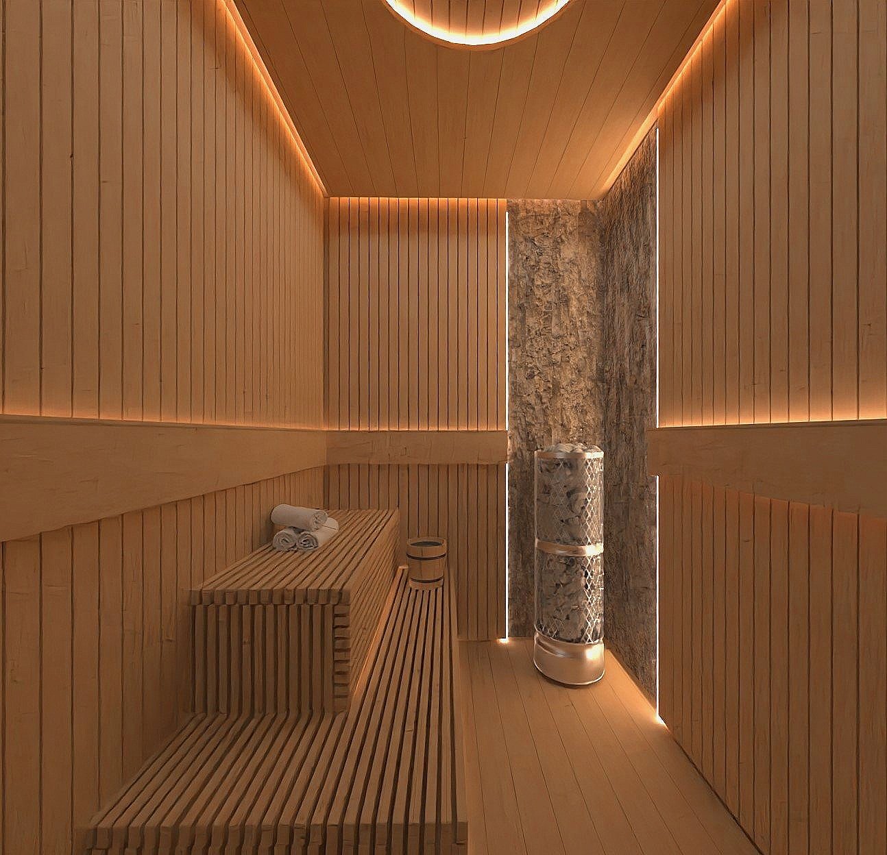 Wood-paneled sauna room with LED lighting, a wooden bench, rolled towels, and a stone heater.