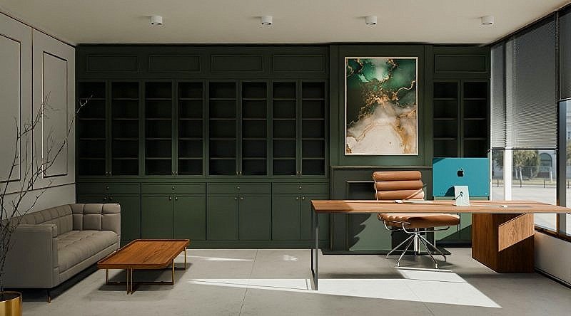 Modern office with dark green built-in bookshelves, a wooden desk with a brown chair, a beige sofa, a small wooden coffee table, a framed abstract art piece, and large windows with blinds.
