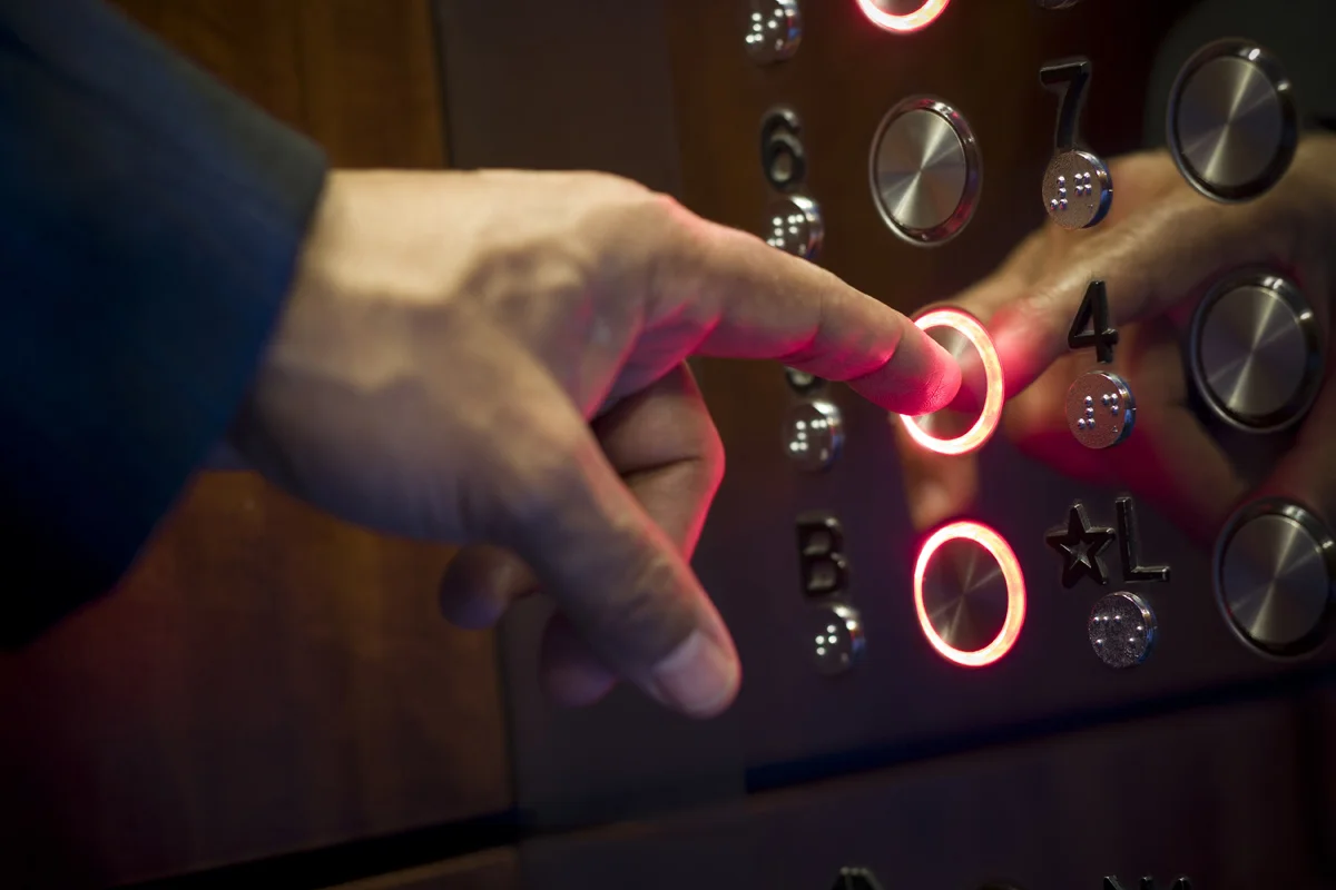 hand-pressing-elevator-button.jpg