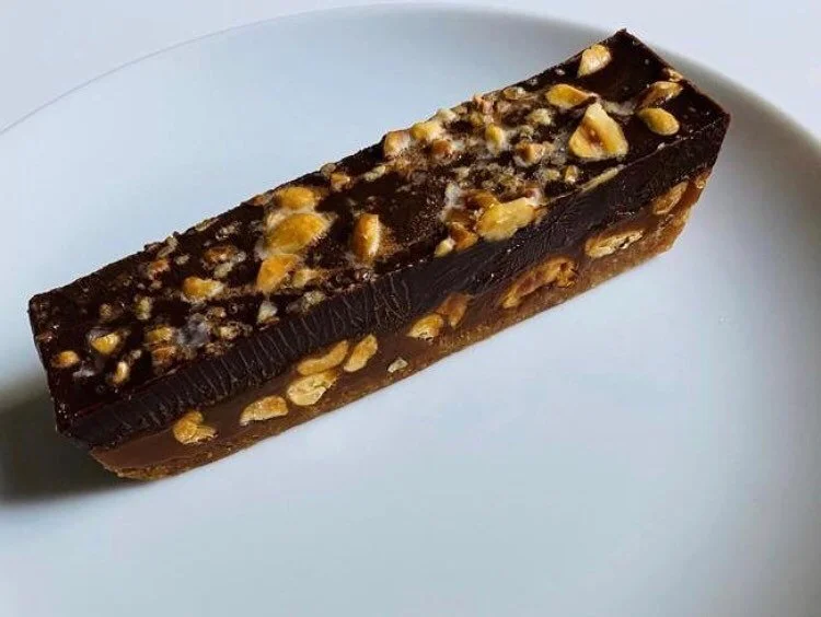 Check out this great snap of our new candy bar by @bobtajc ! It&rsquo;s dark chocolate ganache, banana caramel, roasted peanut butter short bread crust. Read the article about his carry out experience at https://www.google.com/amp/s/www.ajc.com/enter
