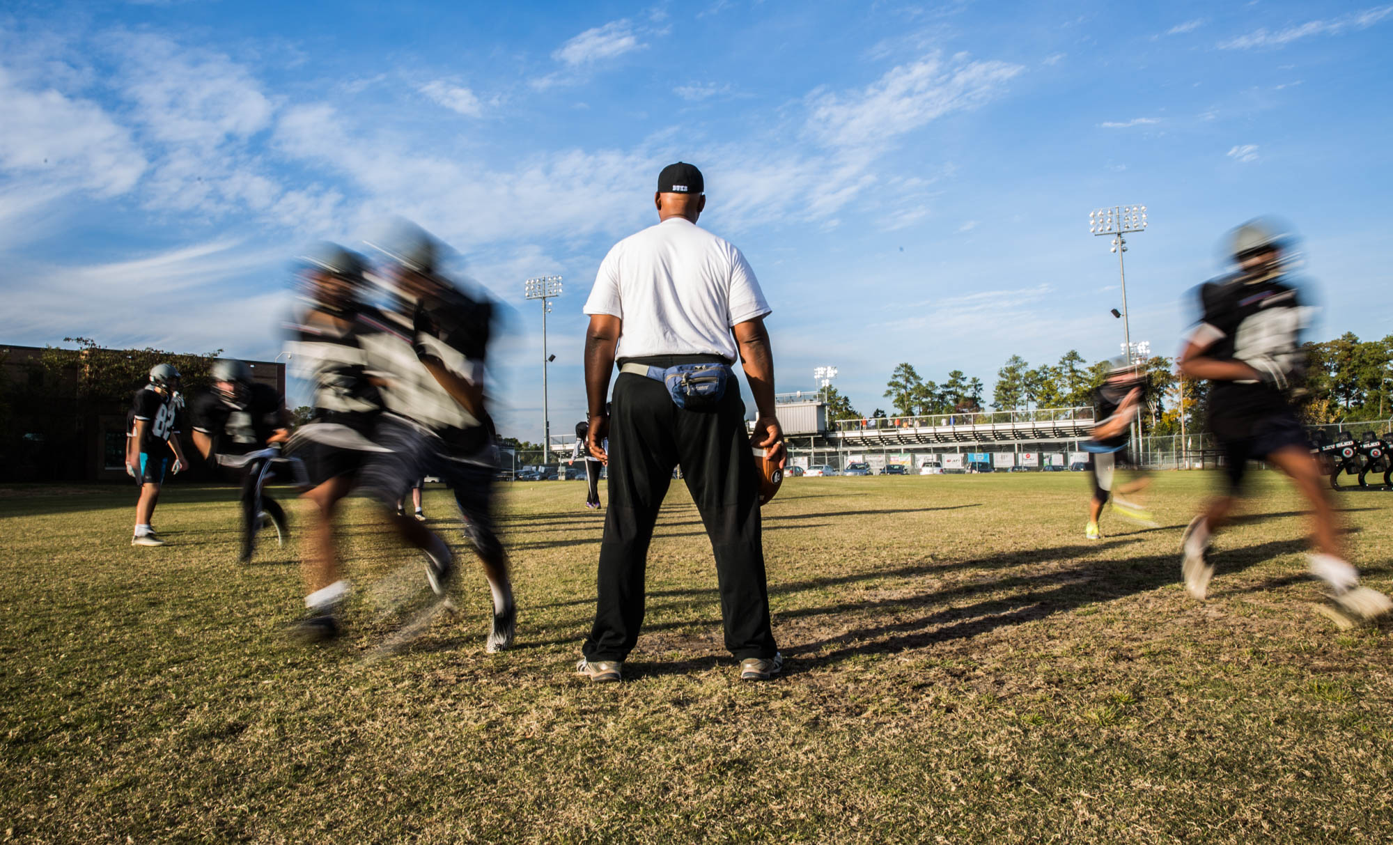 Ted Rogers, the Offensive and Defensive Line Coach puts the team through practice on November 1st, 2017. Because there are so few players, Rogers often has to stand in and tackles with the team. “I feel this year was pretty good. We played hard and actually connected with each other. We worked hard in practice and stayed focused,” said Chandler Farrow, a sophomore offensive lineman.