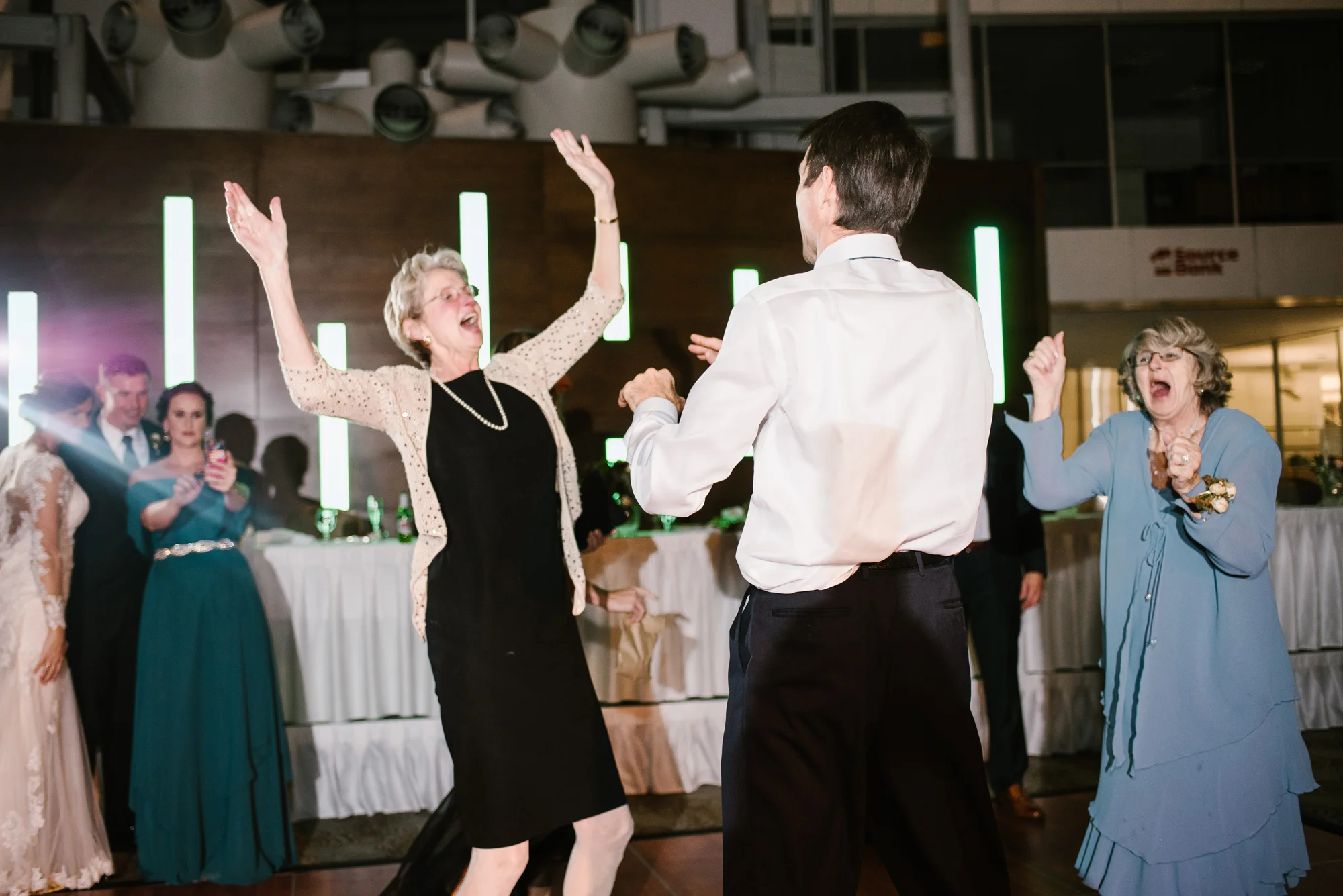 guests having fun dancing at wedding reception