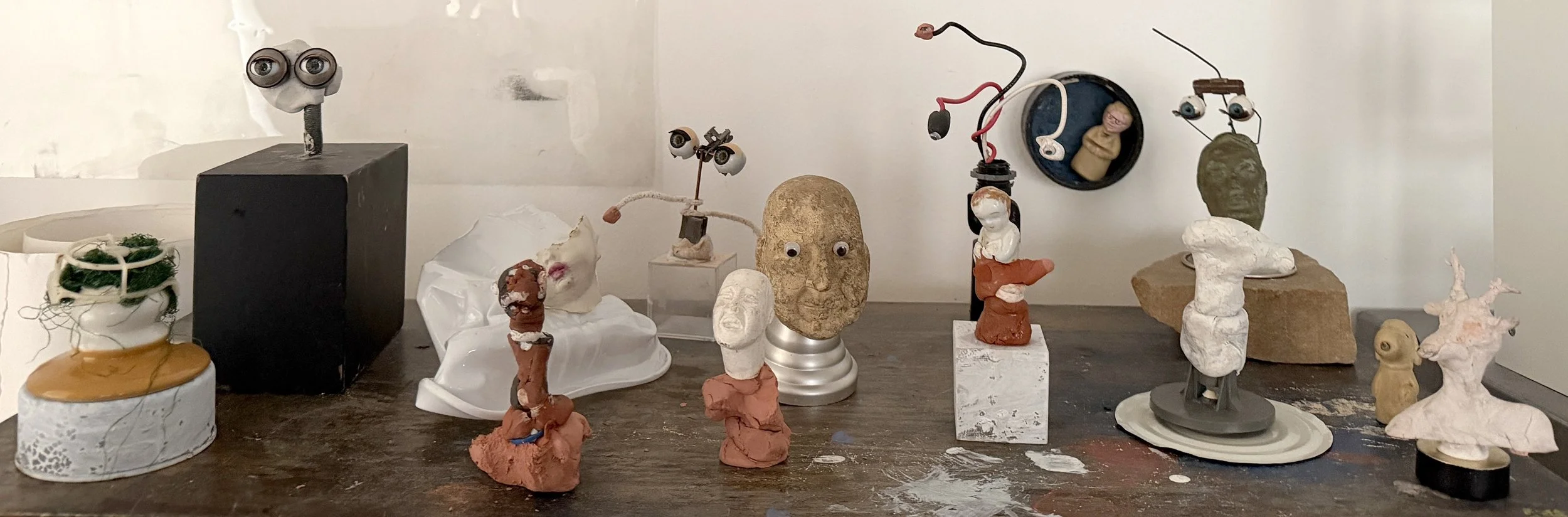 Field of collaged sculptures, mixed media/found objects, 2026