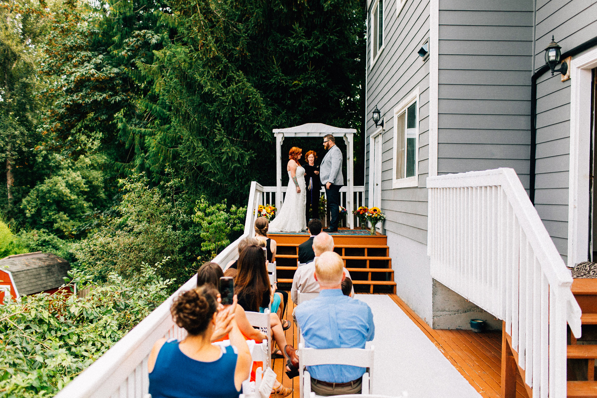 tracey chris seattle backyard at home wedding fuck yeah weddings kendall lauren shea photographer feminist ceremony hand fasting wildflower bouquet tacoma portland deck