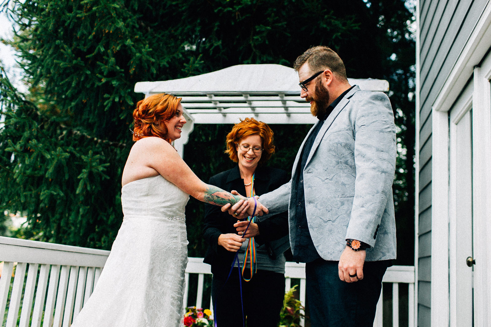 tracey chris seattle backyard at home wedding fuck yeah weddings kendall lauren shea photographer feminist ceremony hand fasting wildflower bouquet tacoma portland deck
