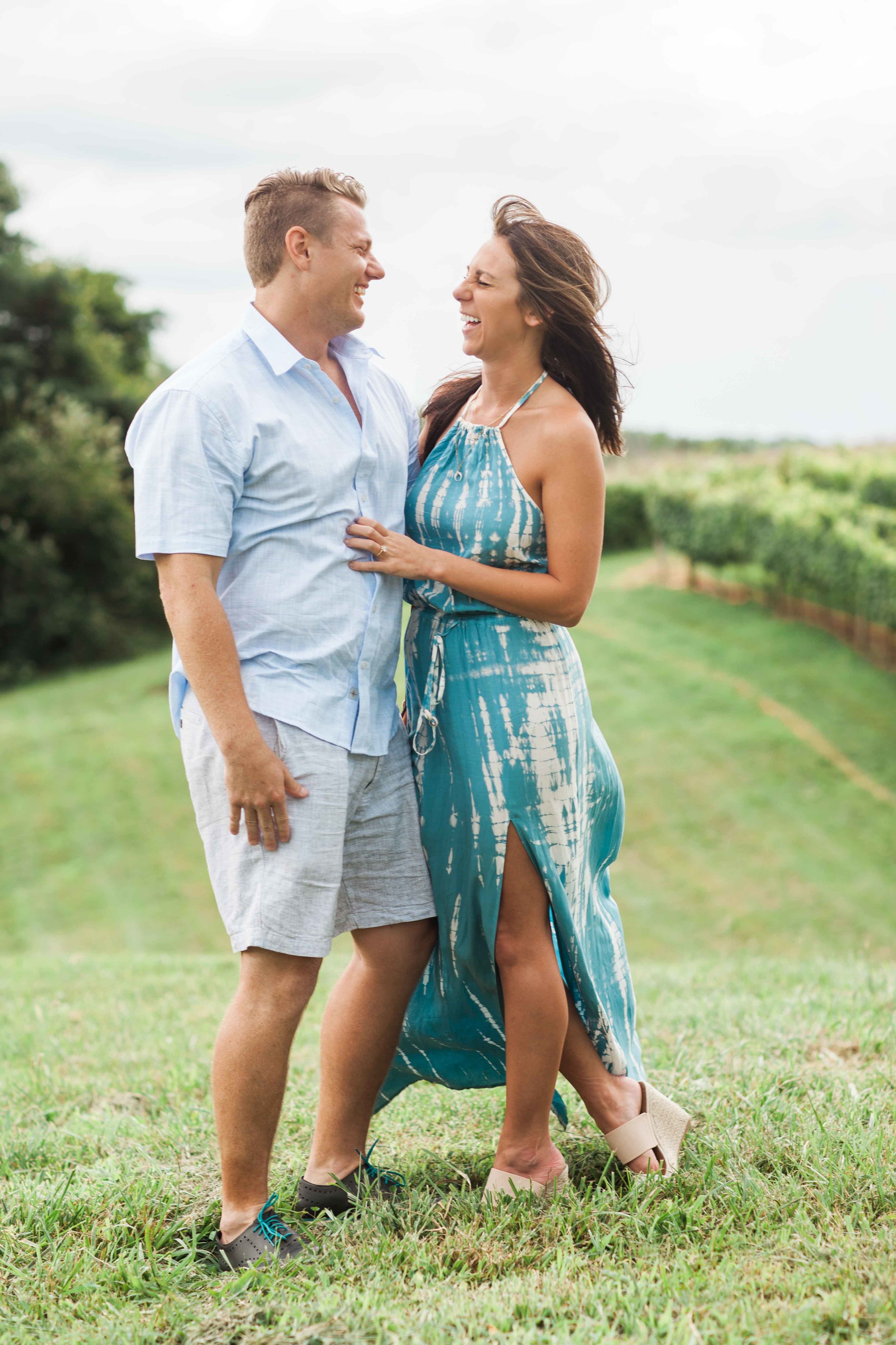 Fun couple get engaged in the vineyard