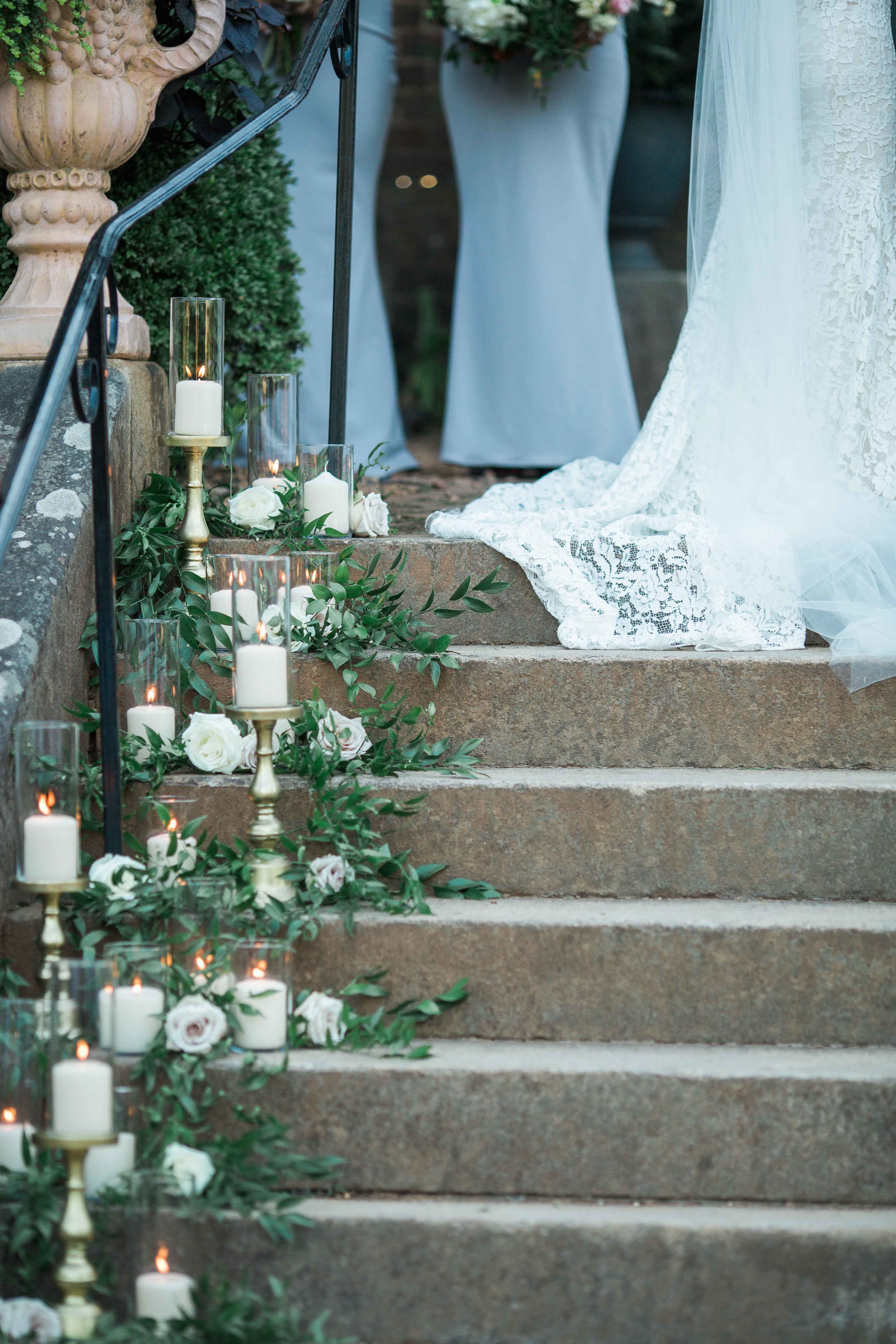 Wedding aisle greenery and candles