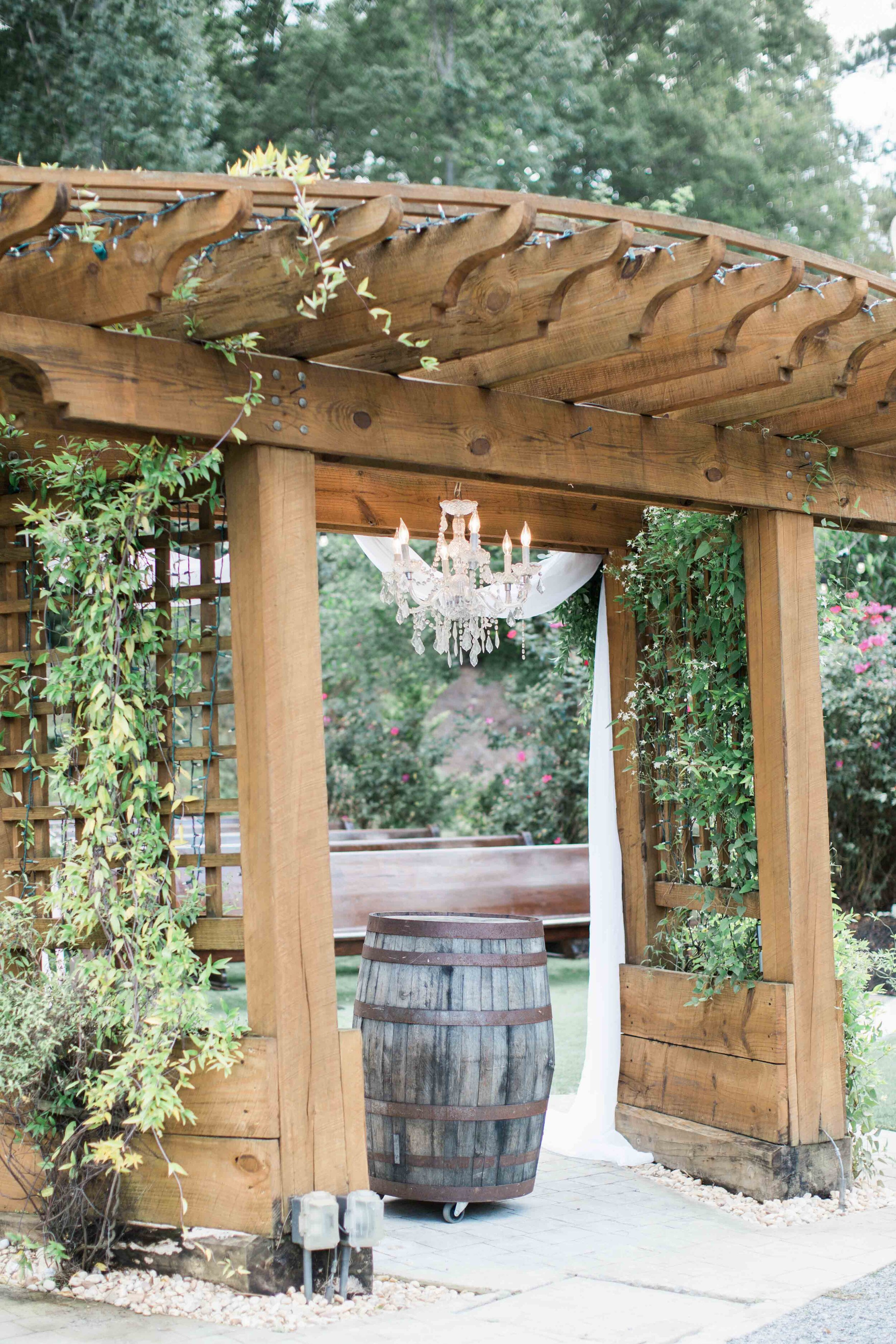 Chandelier wedding aisle wood arch