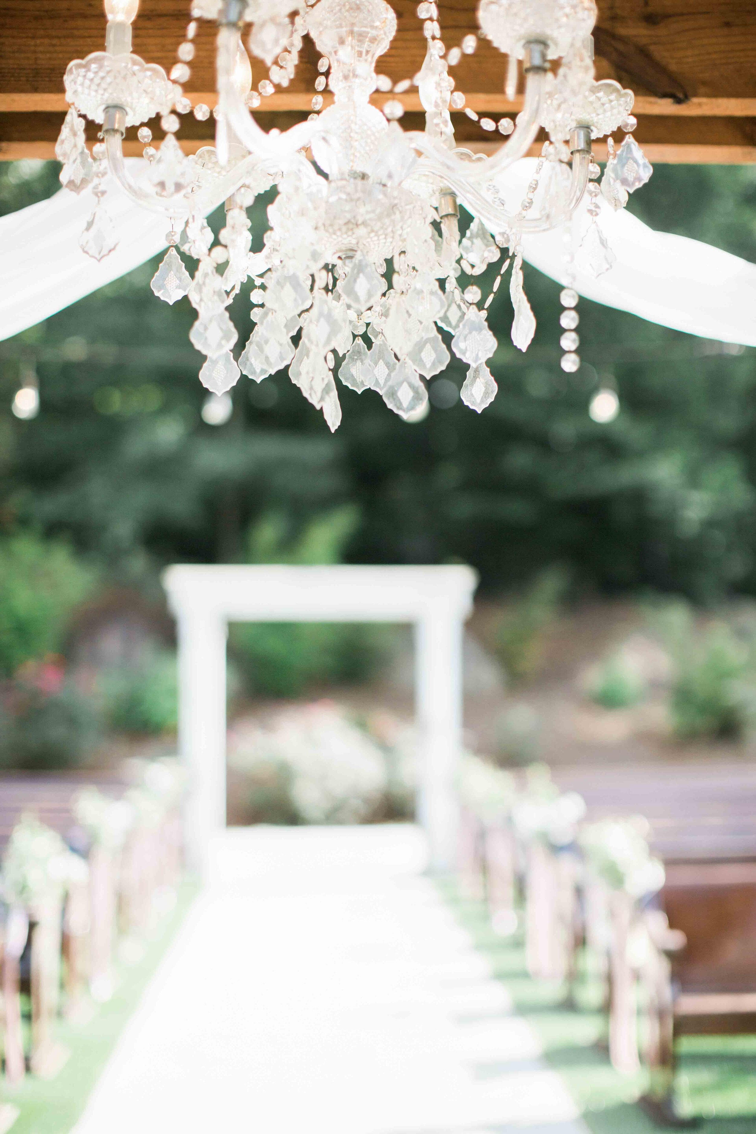 Gorgeous chandelier wedding aisle