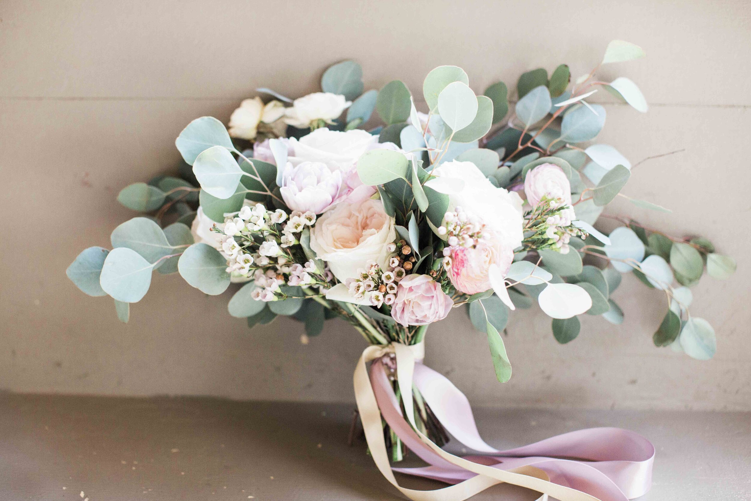 Spring bridal bouquet of pastels and eucalyptus   