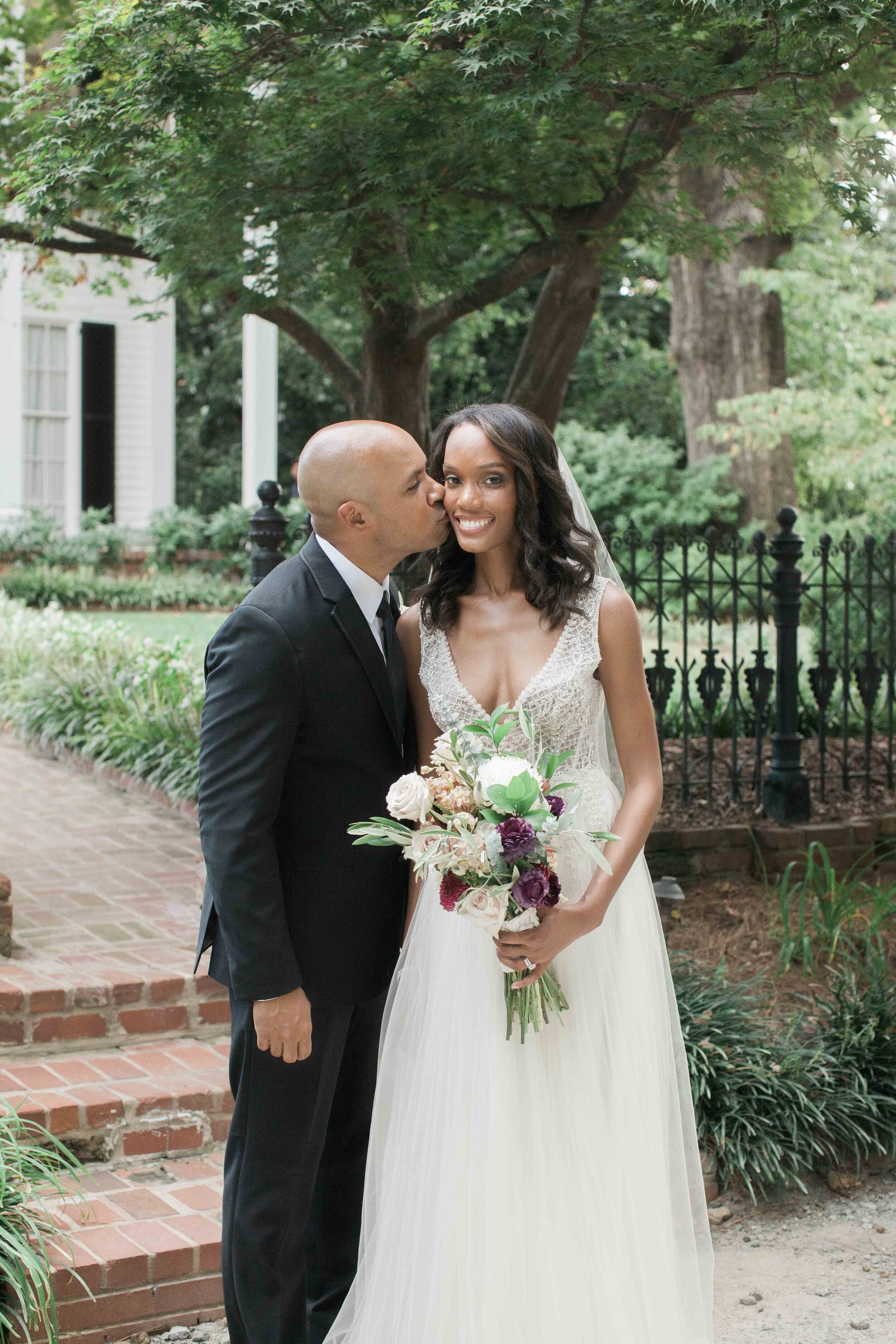 Bride in white tulle dress with gorgeous mauve cream and gold bouquet