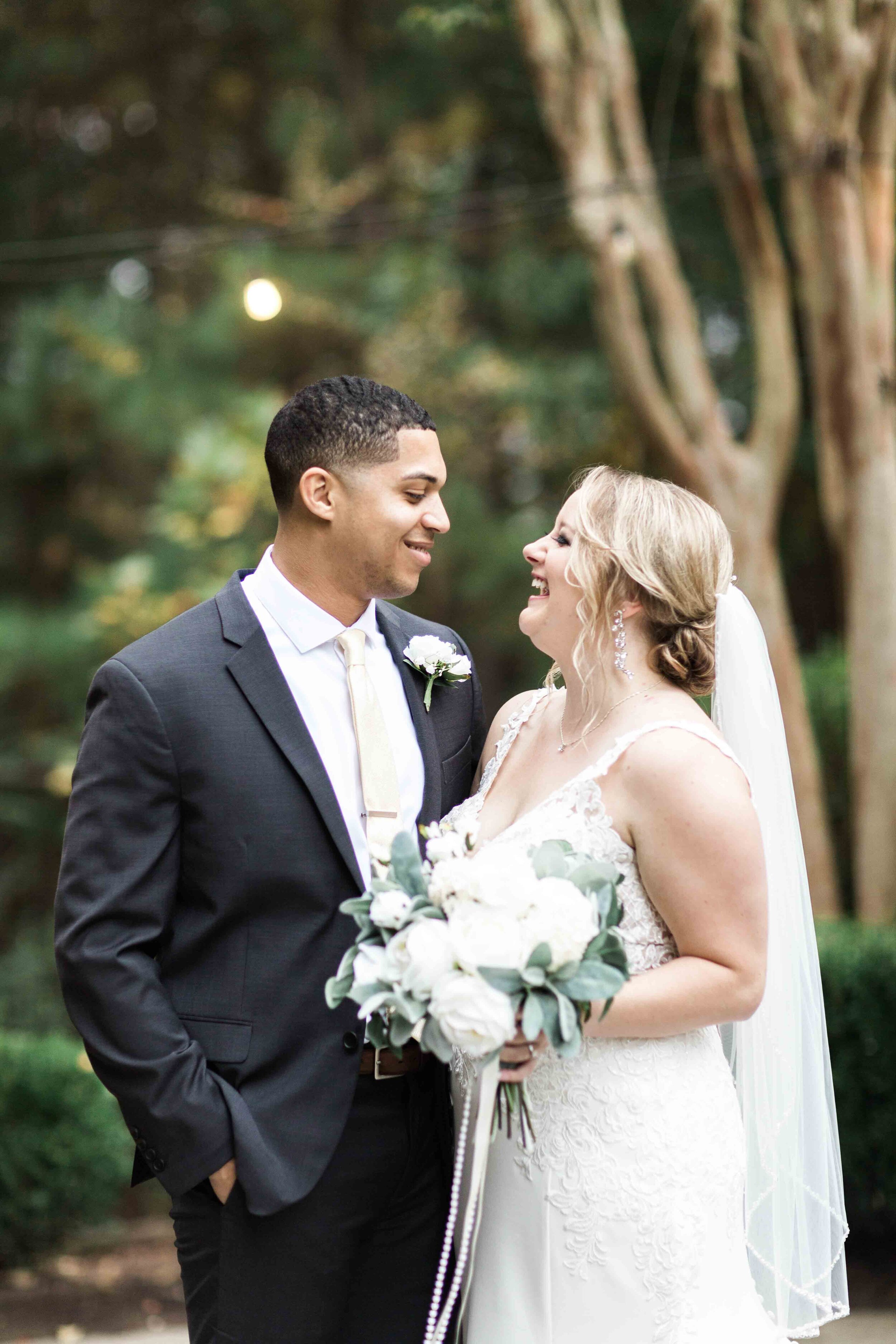 bright and airy bride and groom sharing smiles