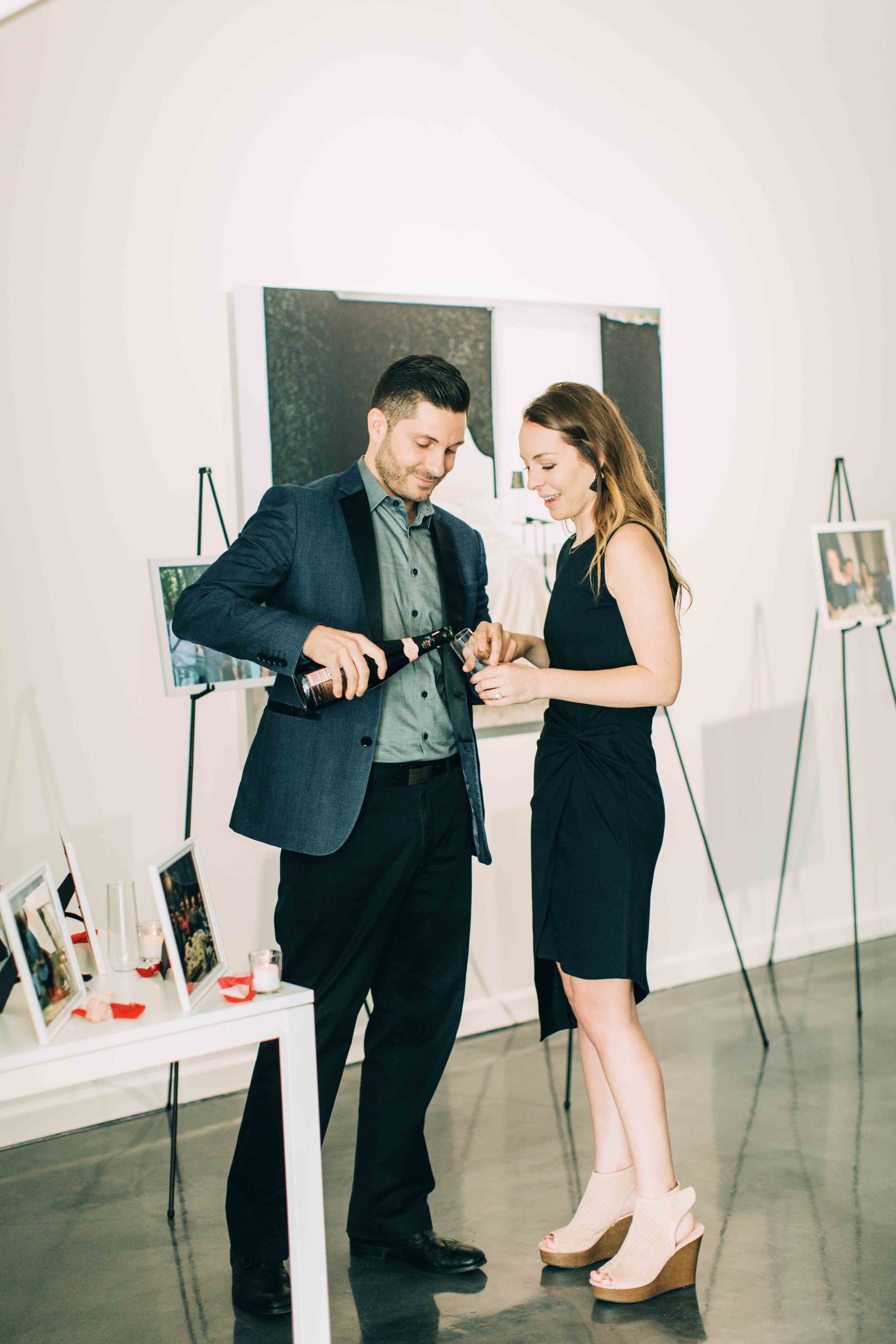 Couple celebrates with champagne at engagement