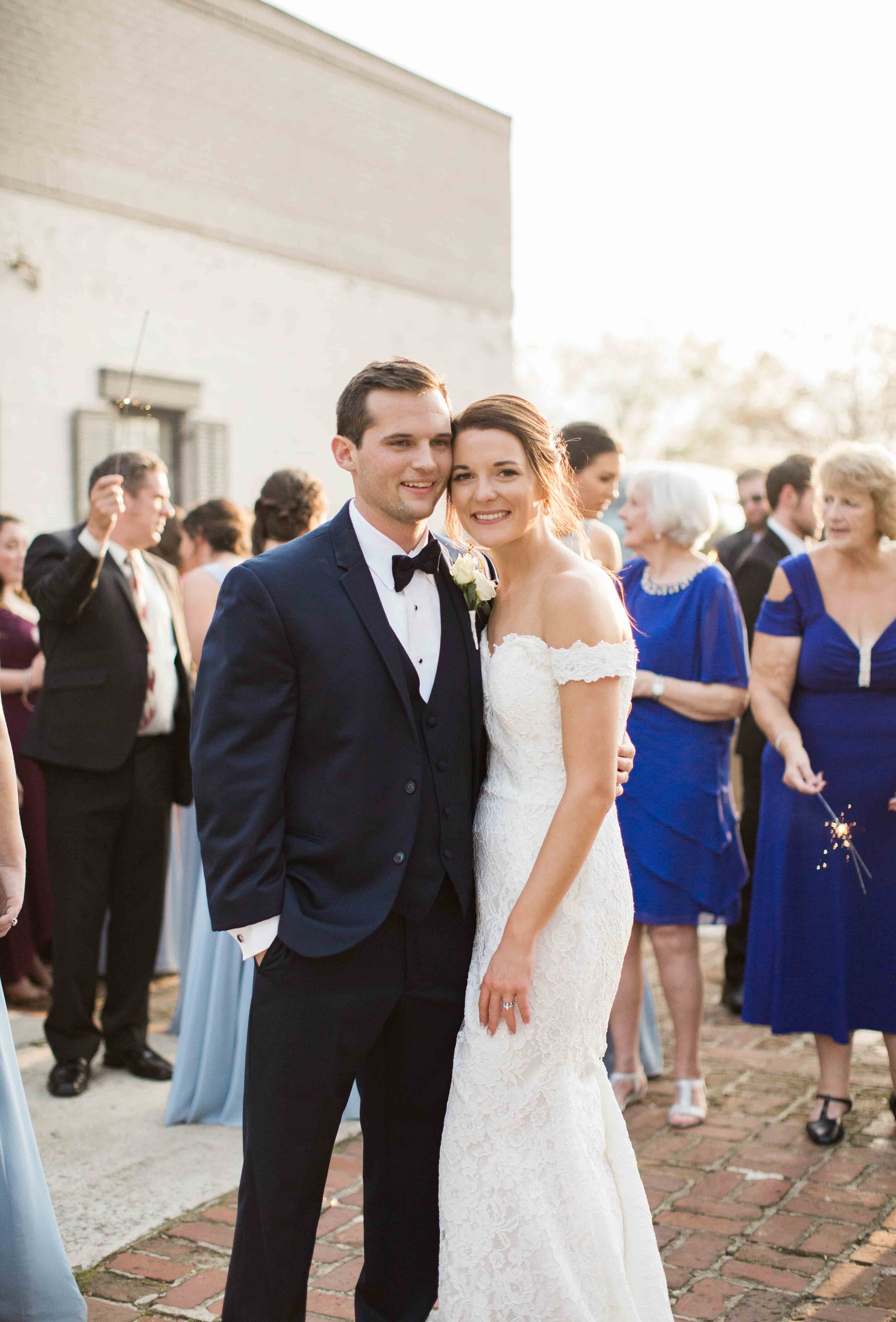 sunset bride and groom reception with guests