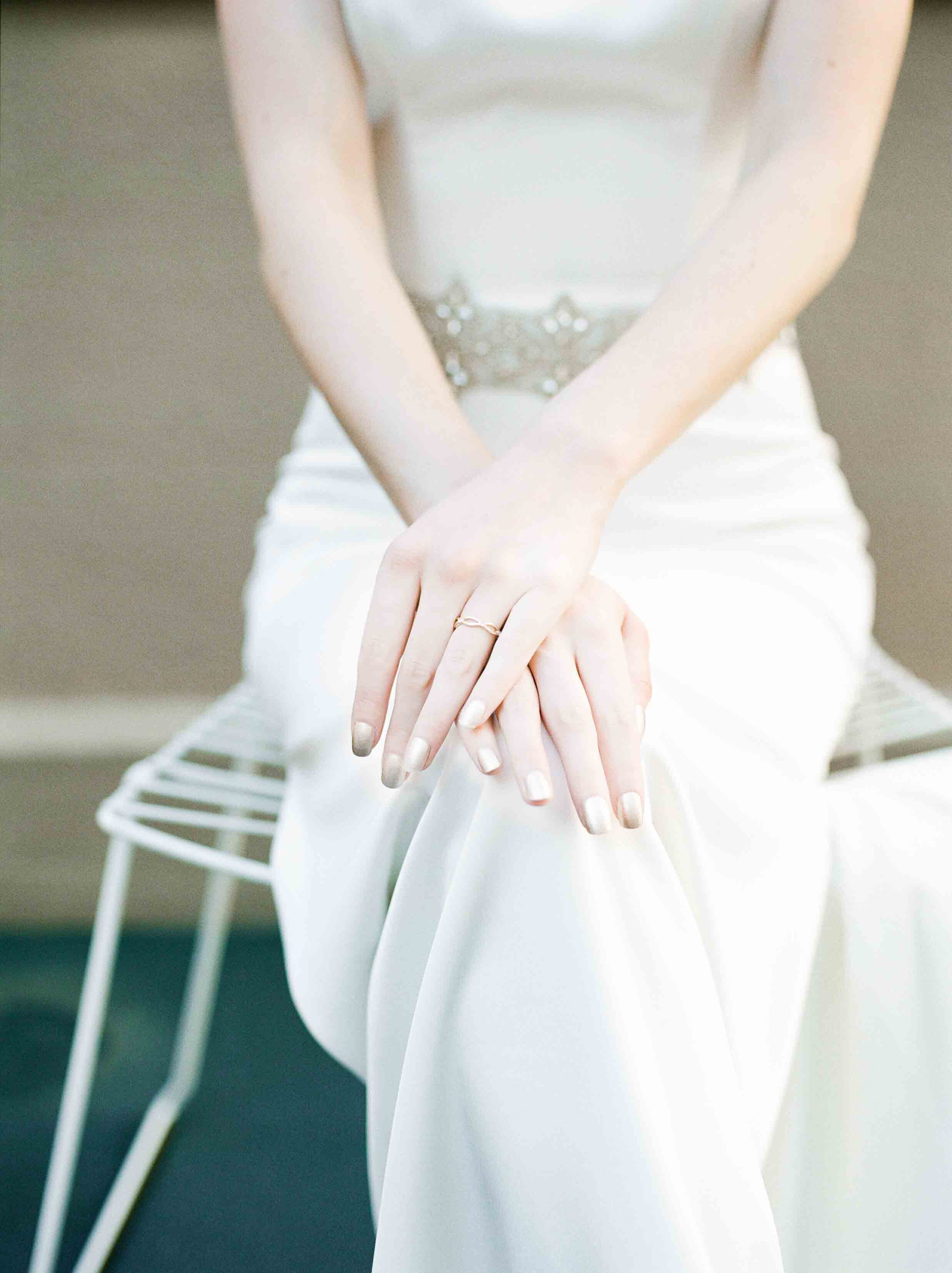 nude nails with satin white wedding gown